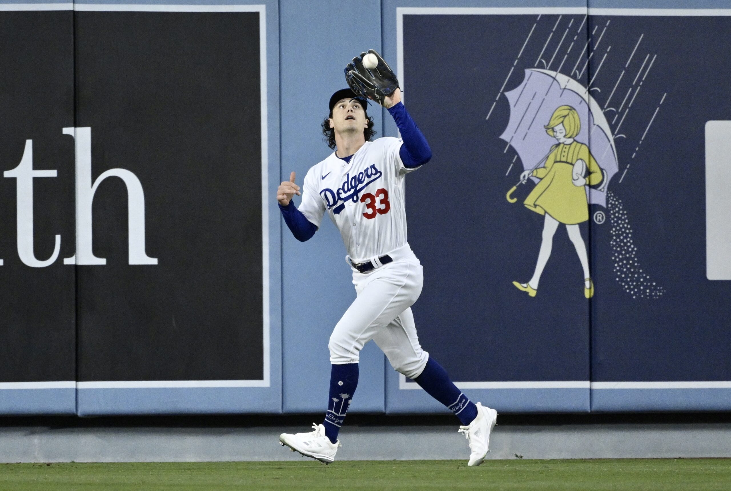 Dodgers center fielder James Outman makes the catch on a...