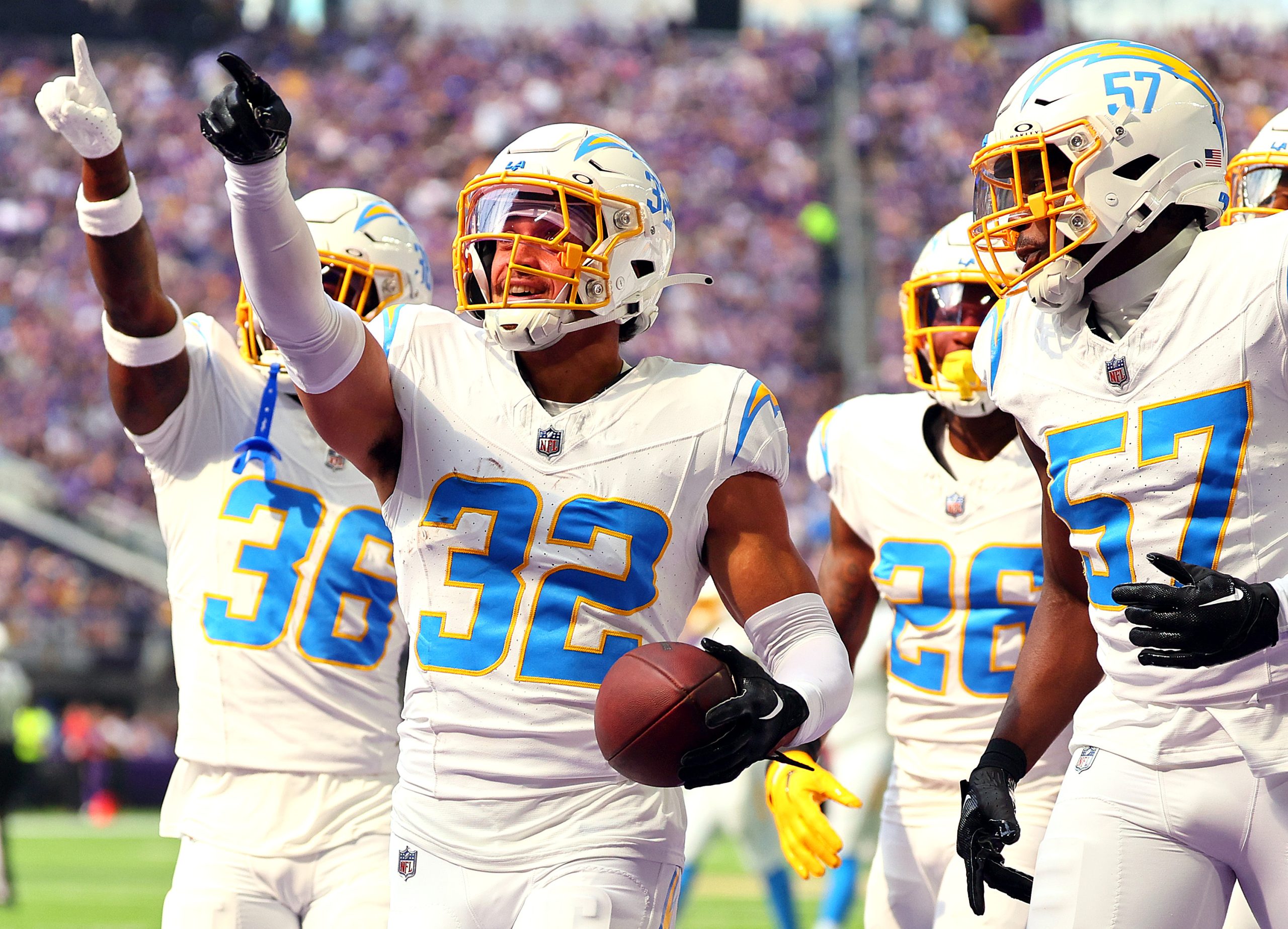 Alohi Gilman of the Los Angeles Chargers celebrates after recovering...