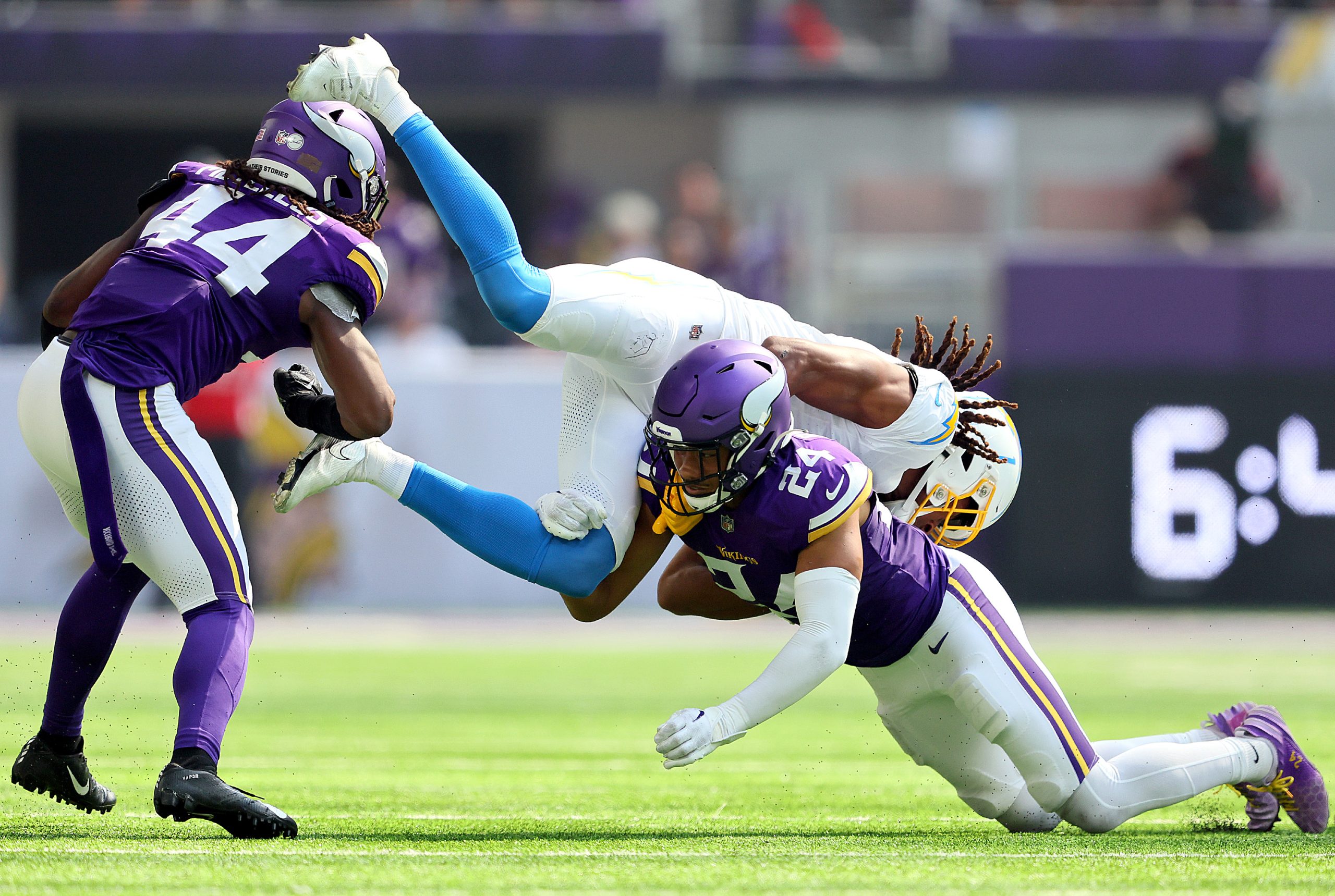 Camryn Bynum of the Minnesota Vikings tackles Quentin Johnston of...