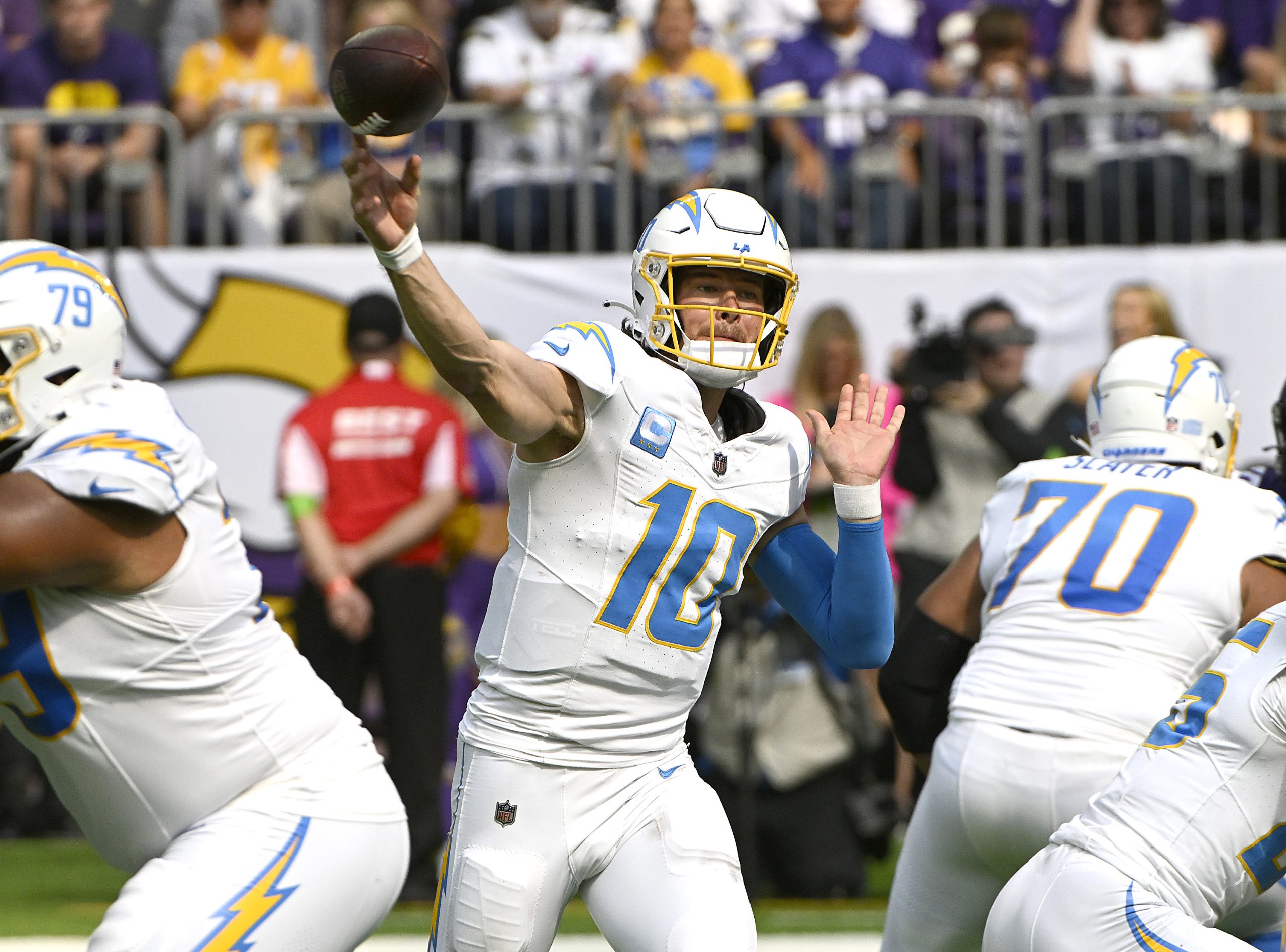 Justin Herbert of the Los Angeles Chargers attempts a pass...