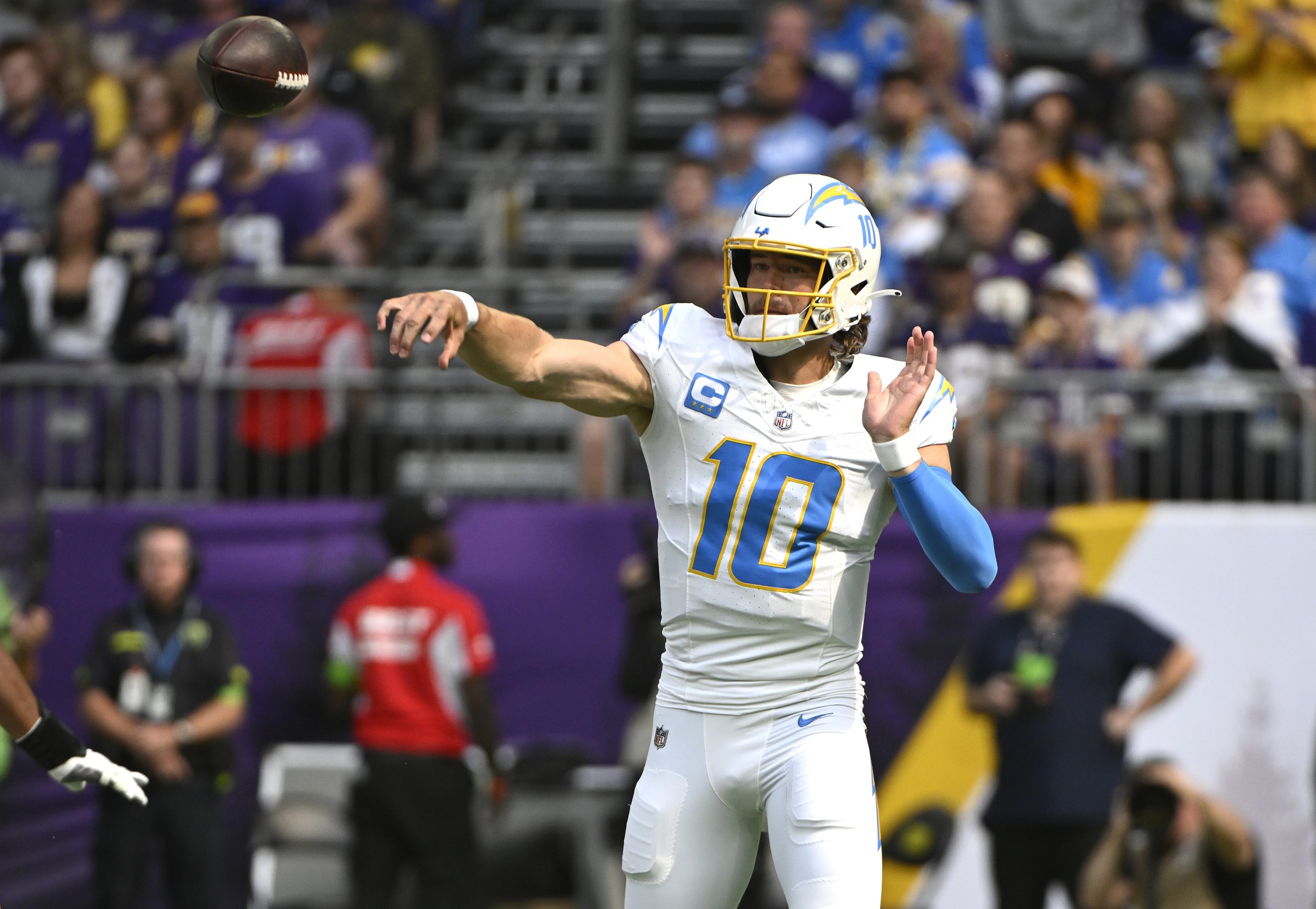 Justin Herbert of the Los Angeles Chargers attempts a pass...