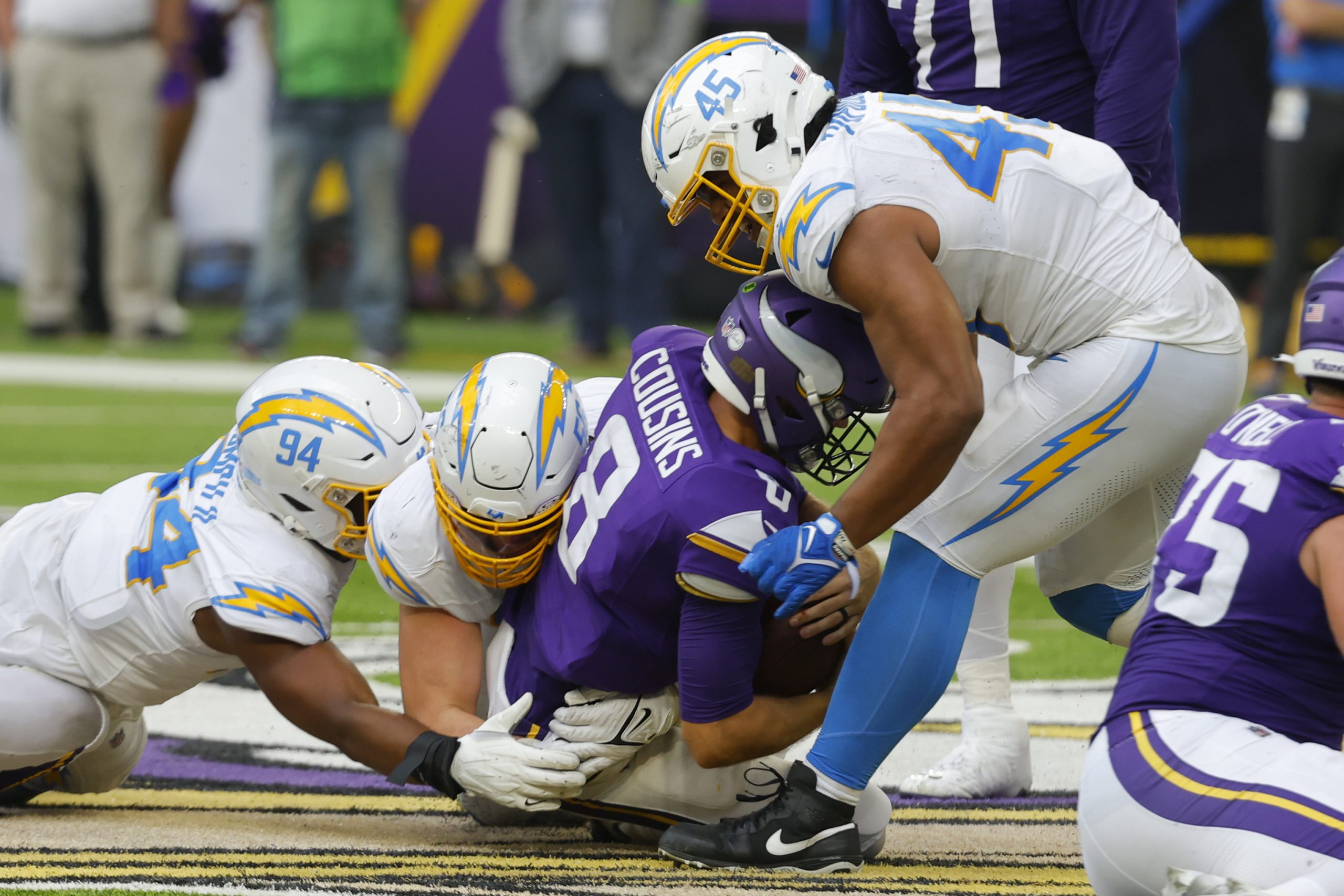 Minnesota Vikings quarterback Kirk Cousins is sacked by Los Angeles...