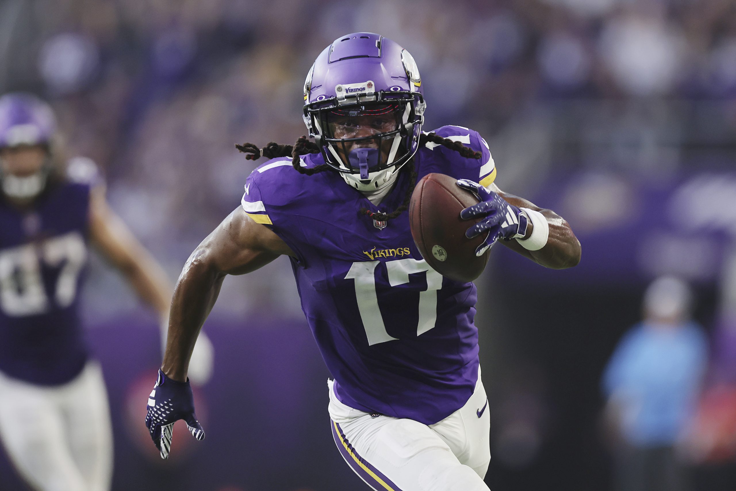 Minnesota Vikings wide receiver K.J. Osborn carries the ball during...