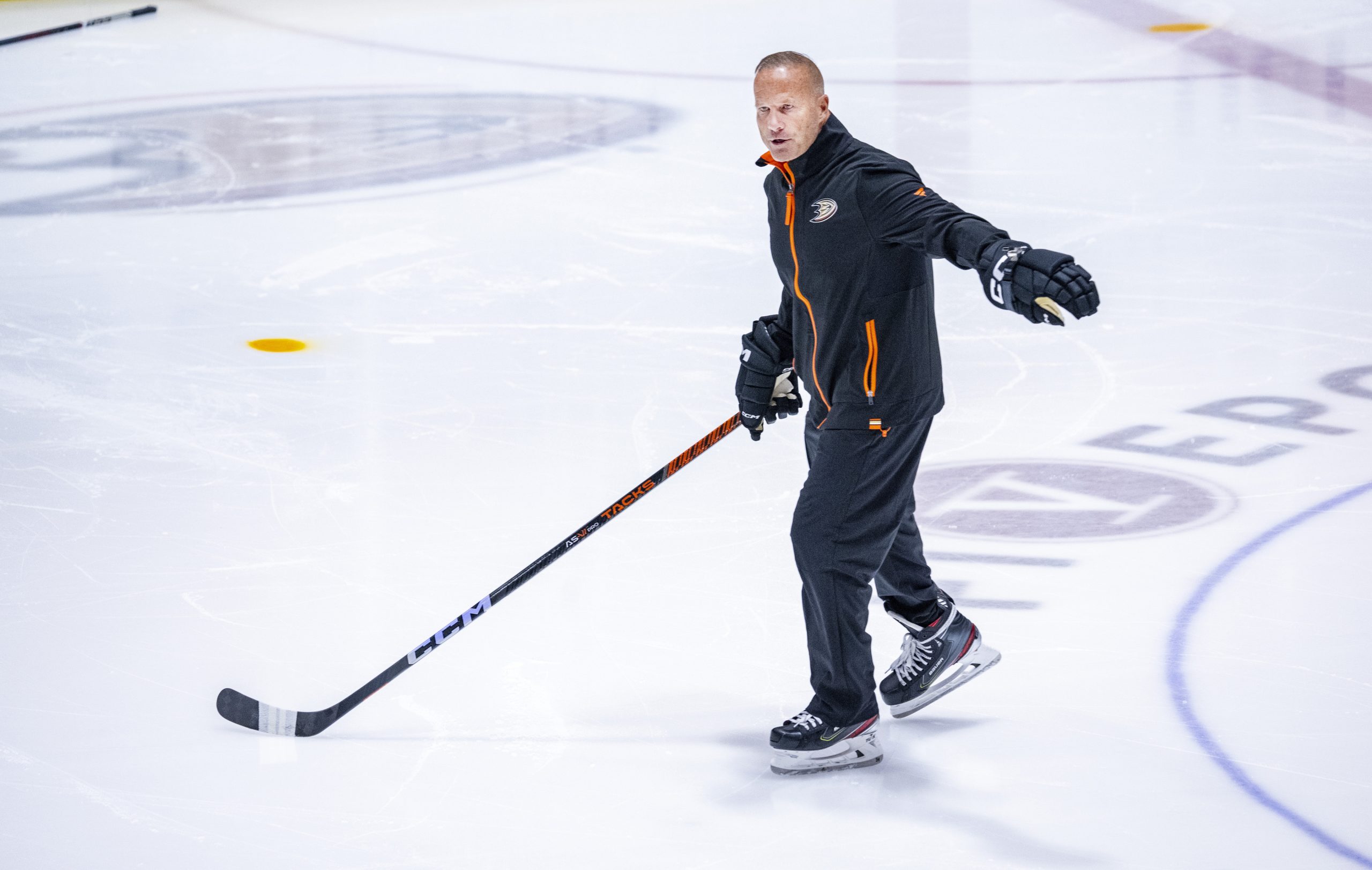 With a hockey stick in hand, new Ducks head coach...