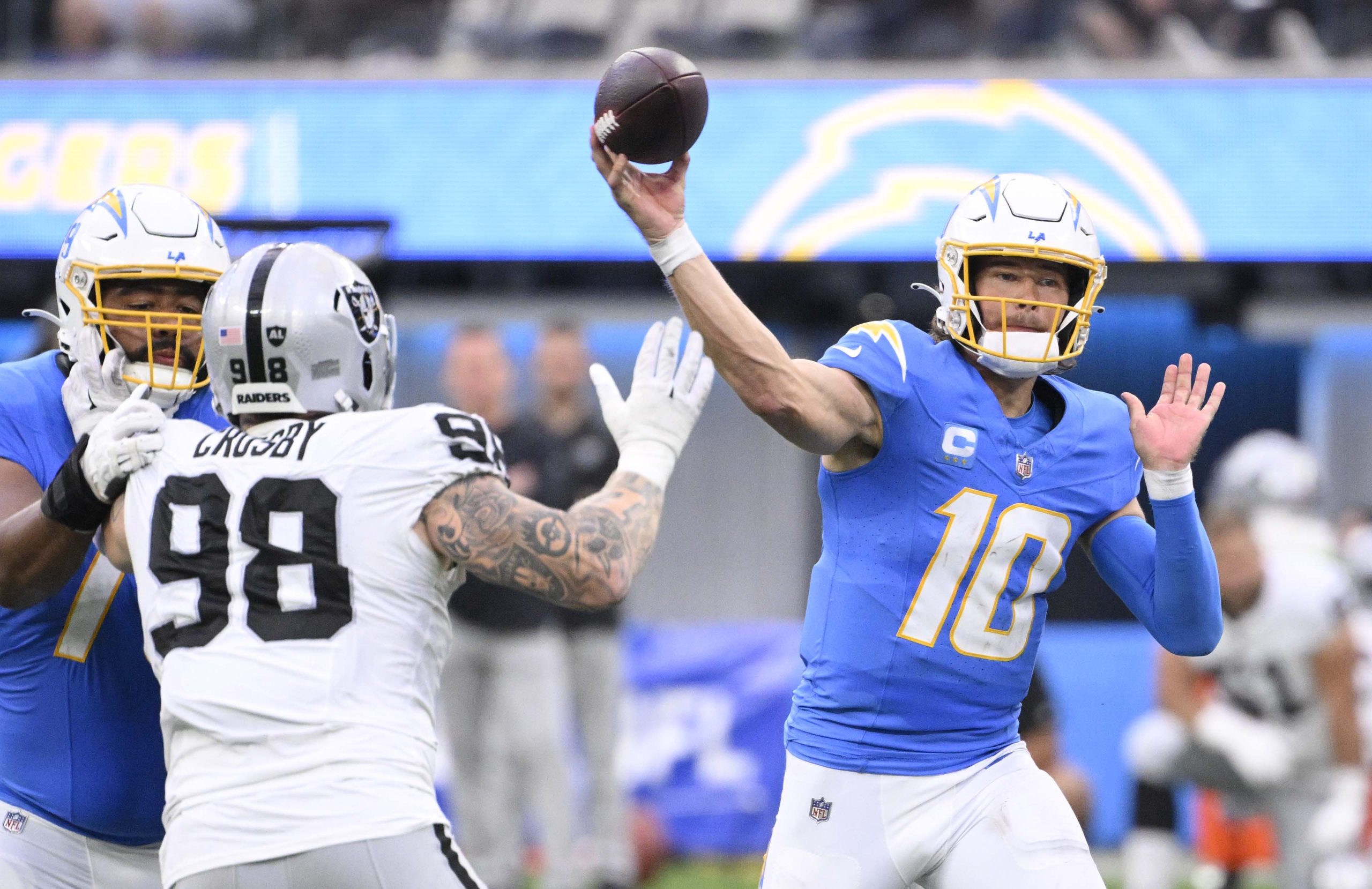 Quarterback Justin Herbert #10 of the Los Angeles Chargers passes...