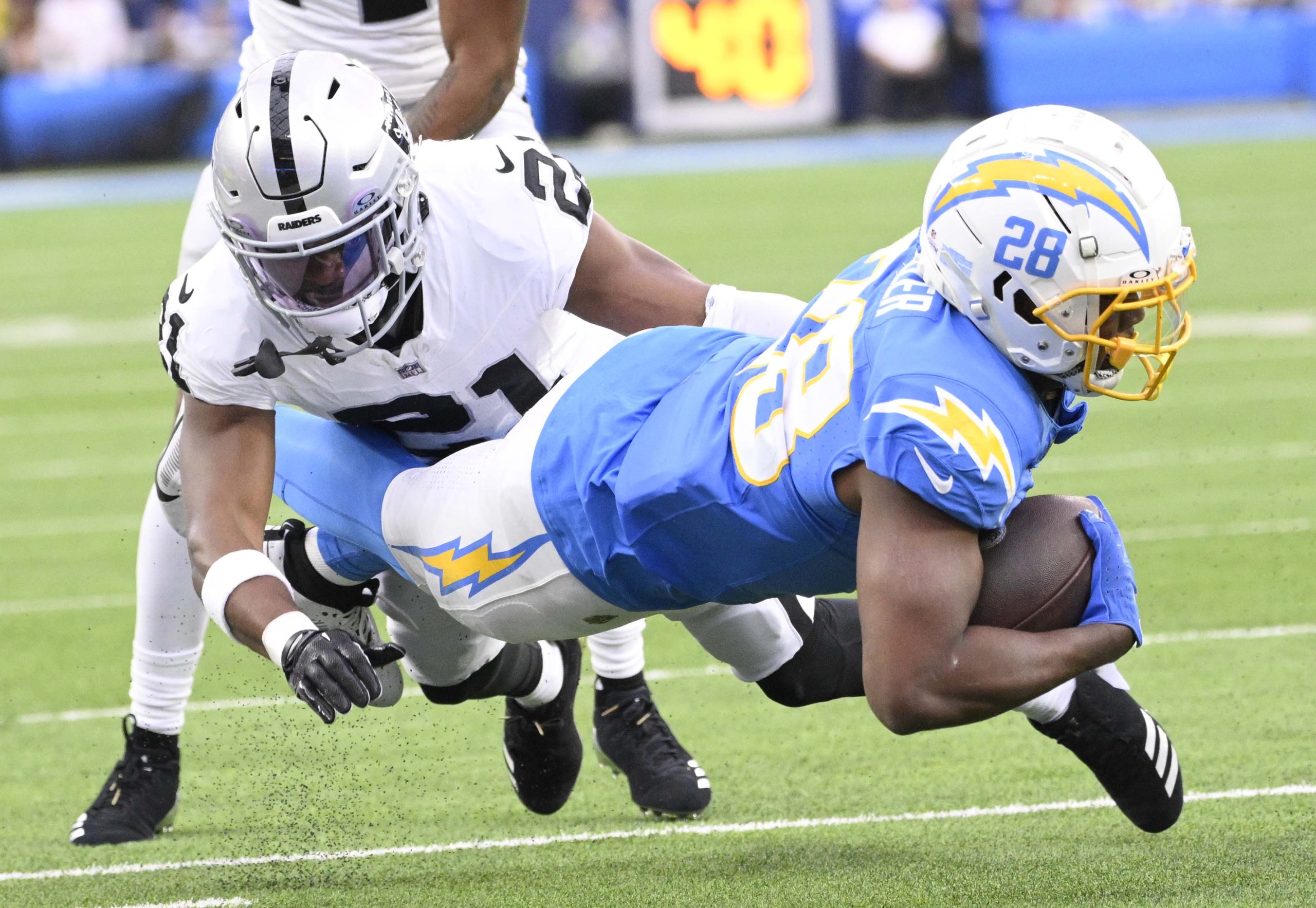 Running back Isaiah Spiller #28 of the Los Angeles Chargers...