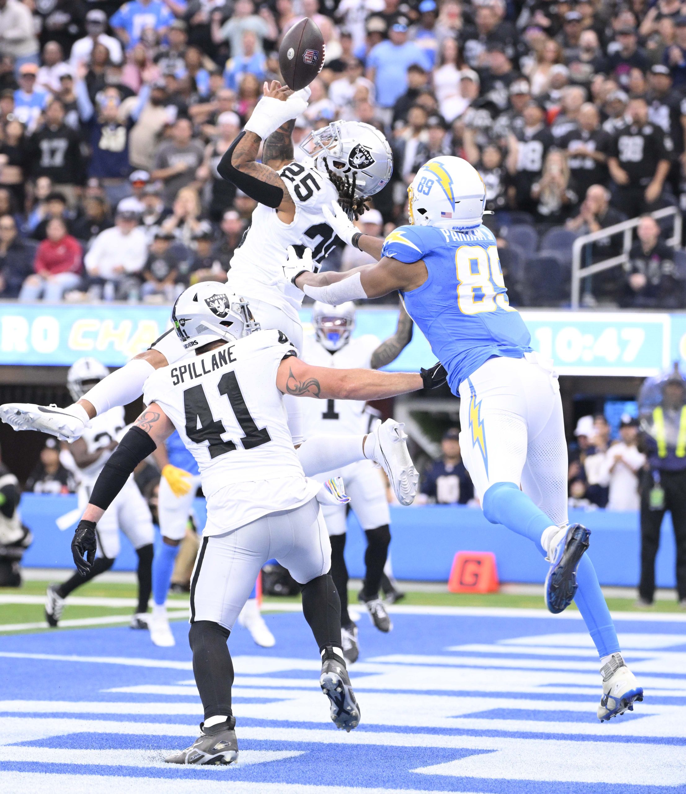 Safety Tre’von Moehrig #25 of the Las Vegas Raiders tips...
