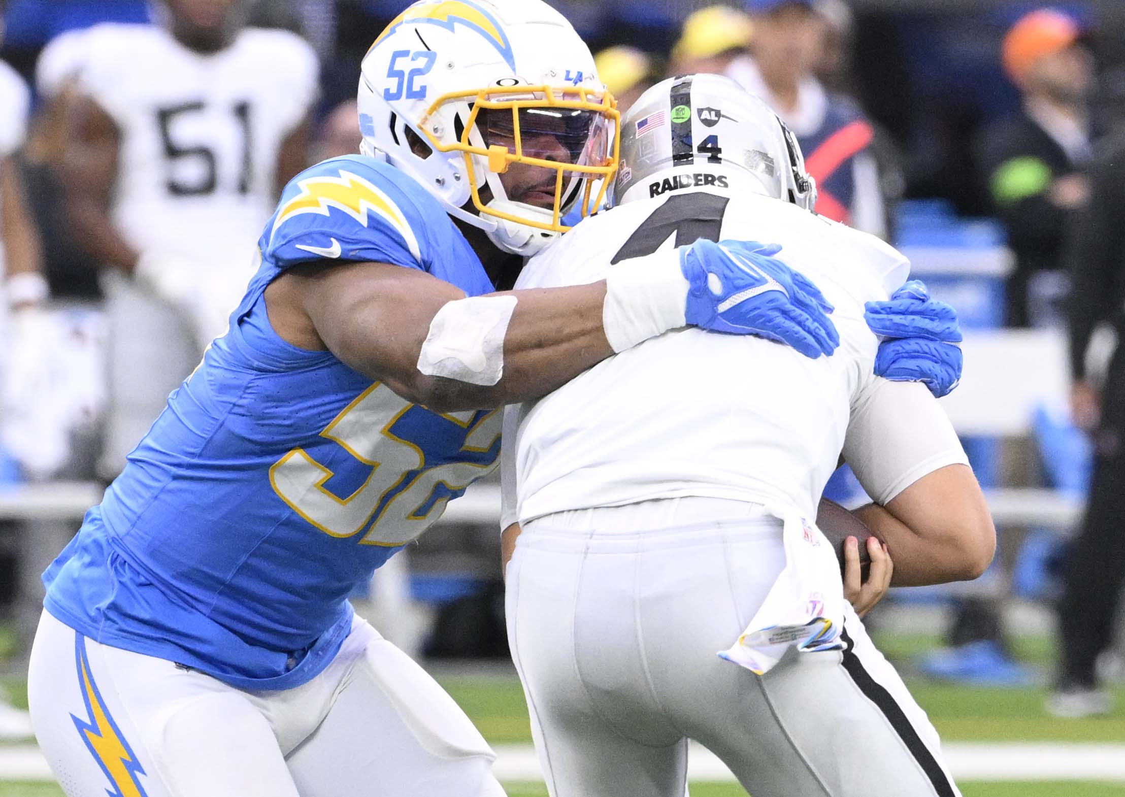 Linebacker Khalil Mack #52 of the Los Angeles Chargers sacks...