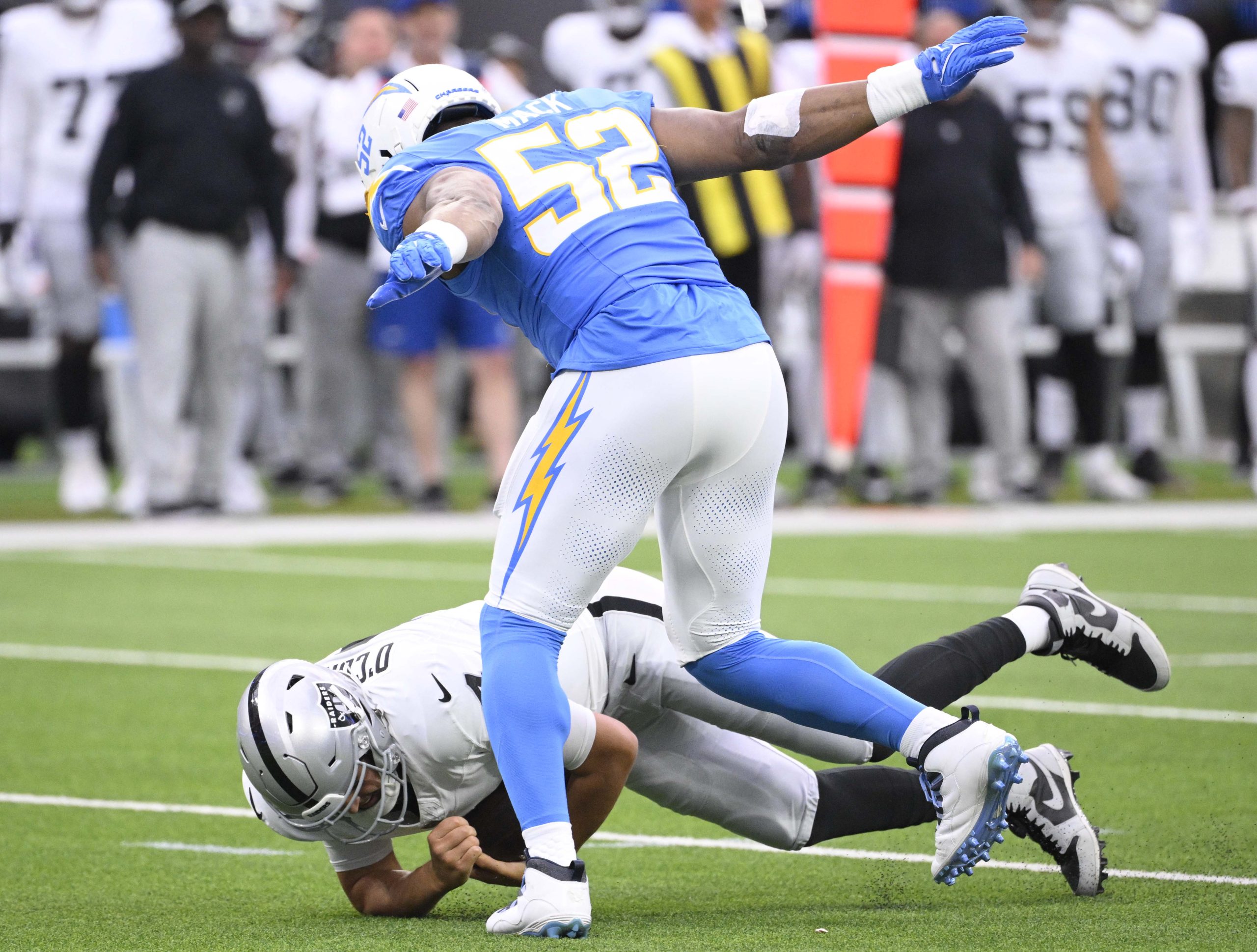 Linebacker Khalil Mack #52 of the Los Angeles Chargers sacks...