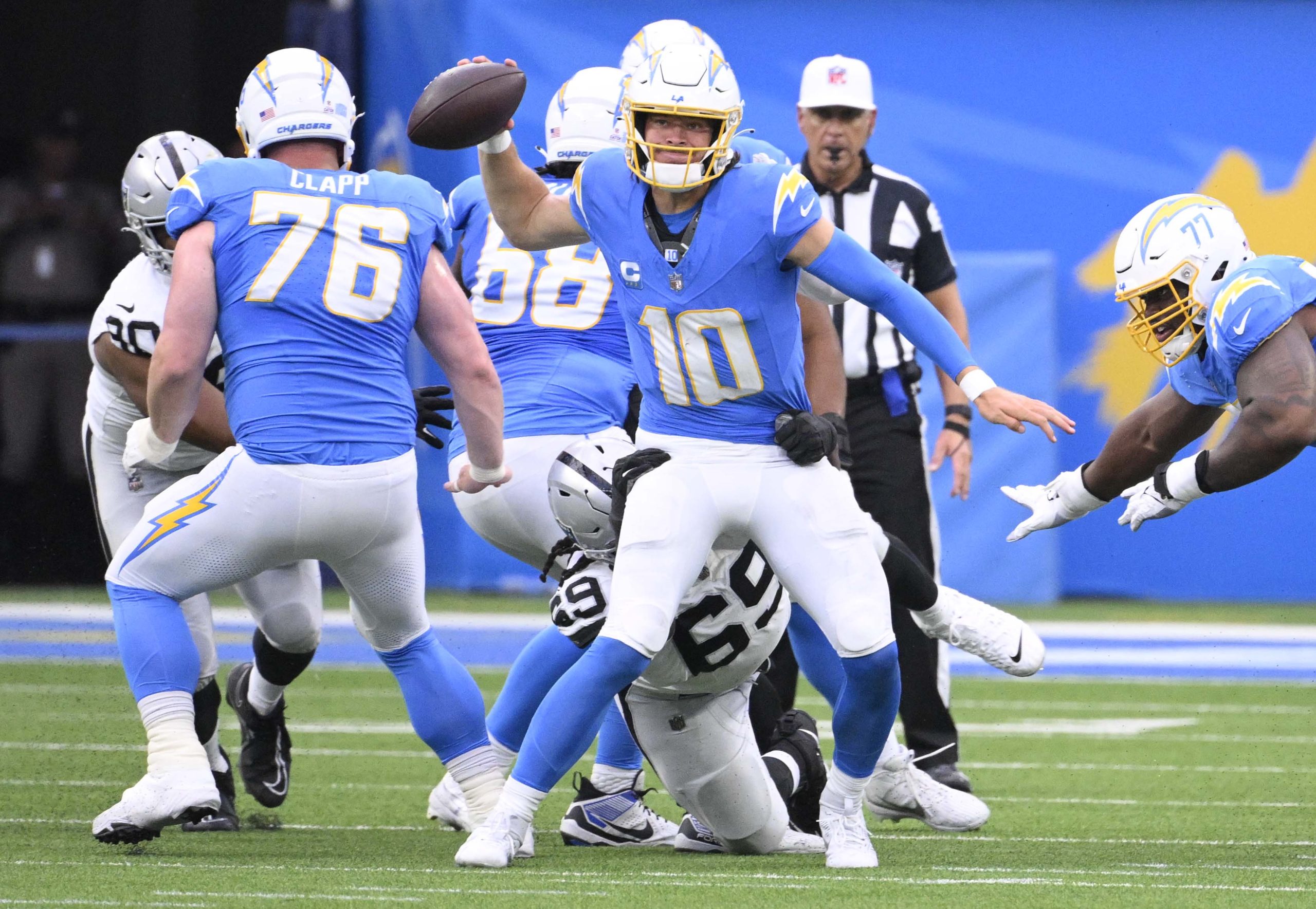 Quarterback Justin Herbert #10 of the Los Angeles Chargers passes...