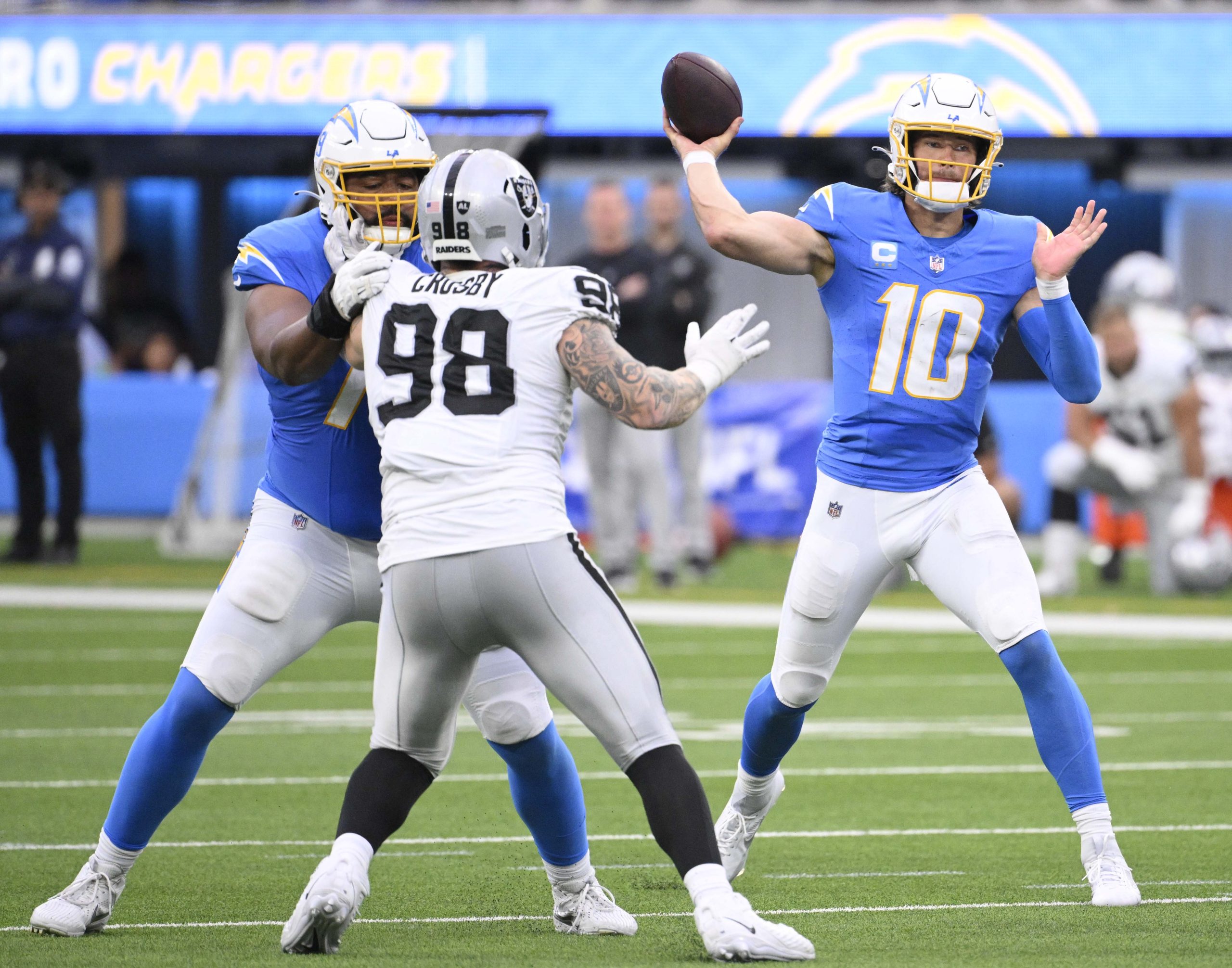Quarterback Justin Herbert #10 of the Los Angeles Chargers passes...