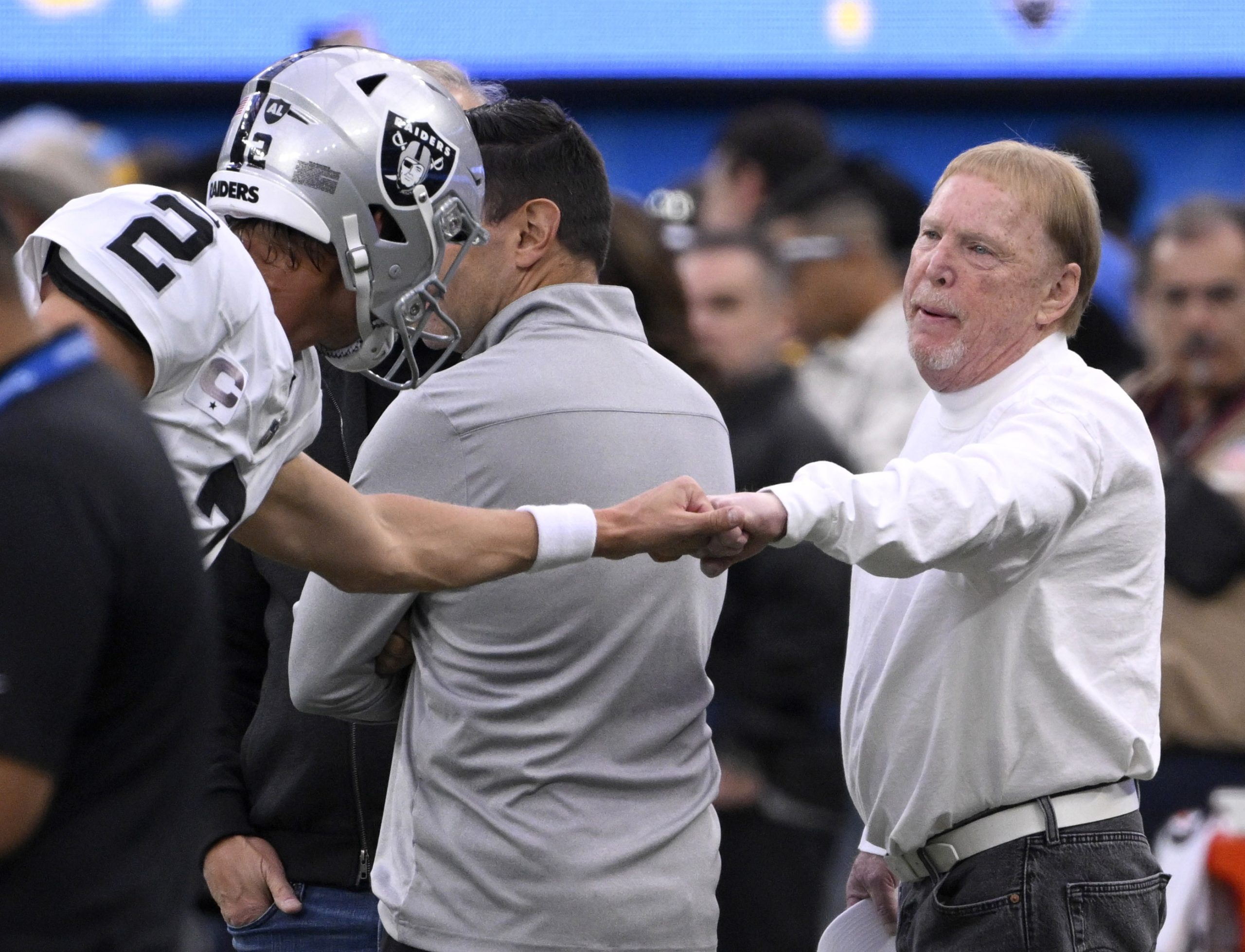 Mark Davis, right, controlling owner and managing general partner of...