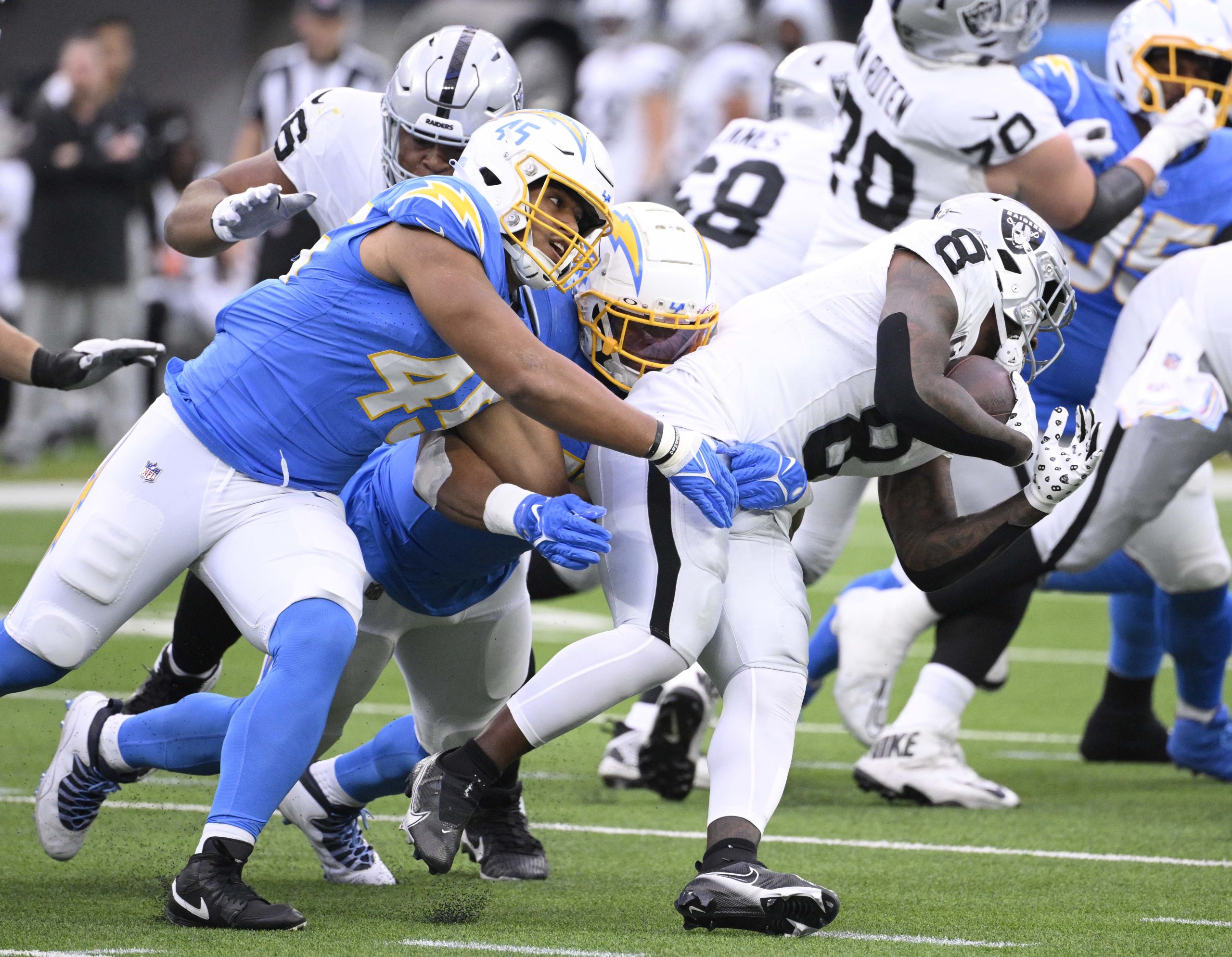 Linebacker Tuli Tuipulotu #45 of the Los Angeles Chargers tackles...