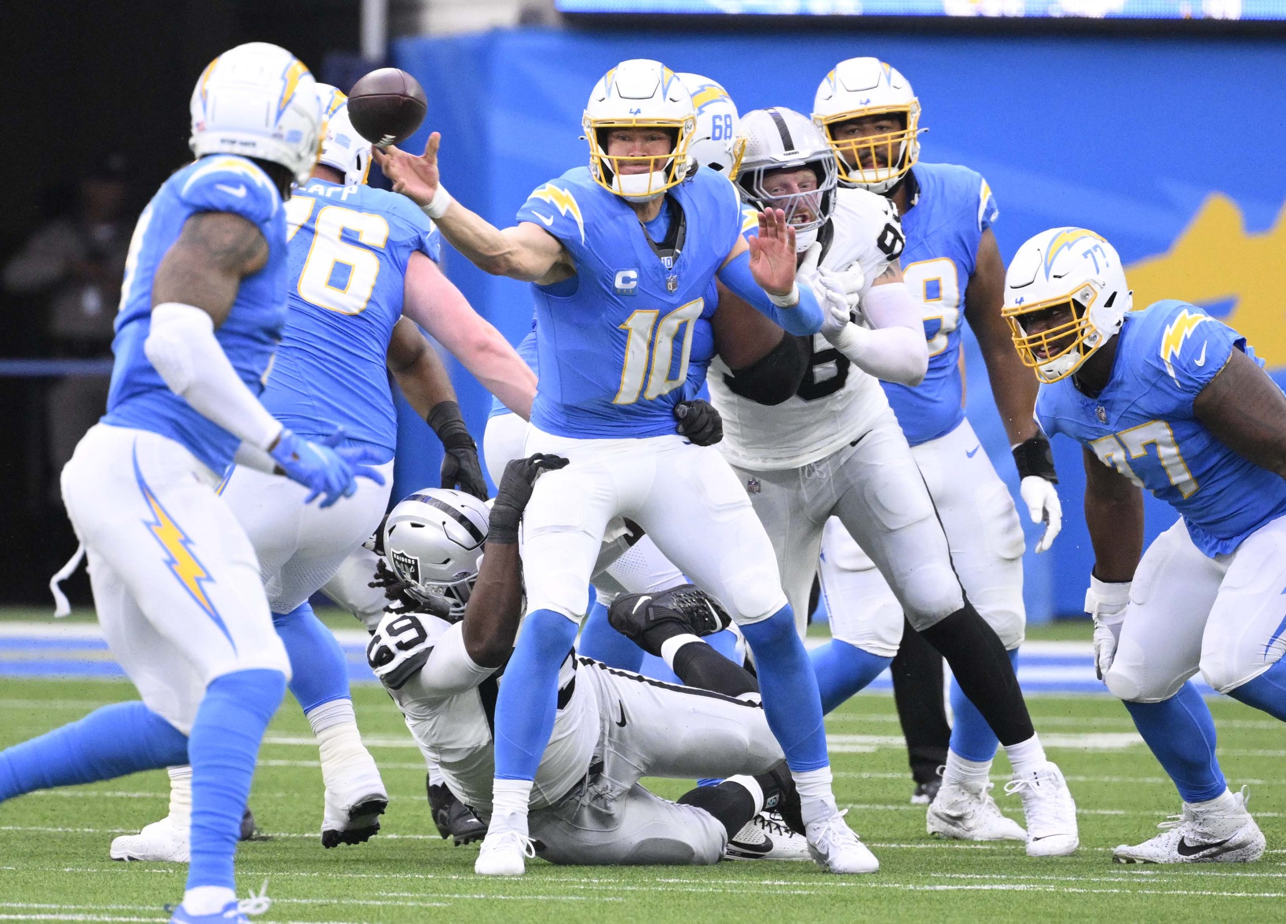 Quarterback Justin Herbert #10 of the Los Angeles Chargers passes...