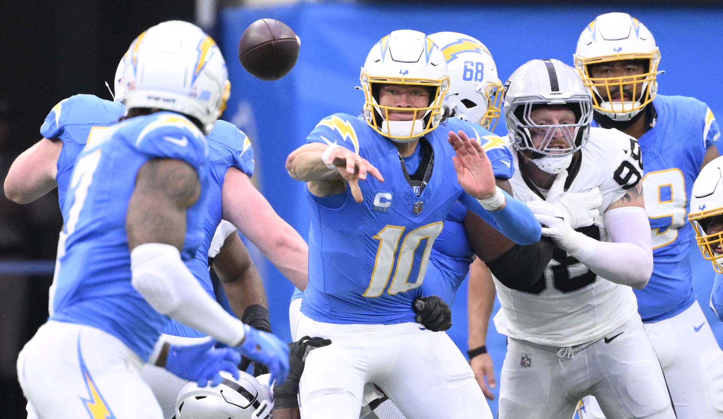 Quarterback Justin Herbert #10 of the Los Angeles Chargers passes...
