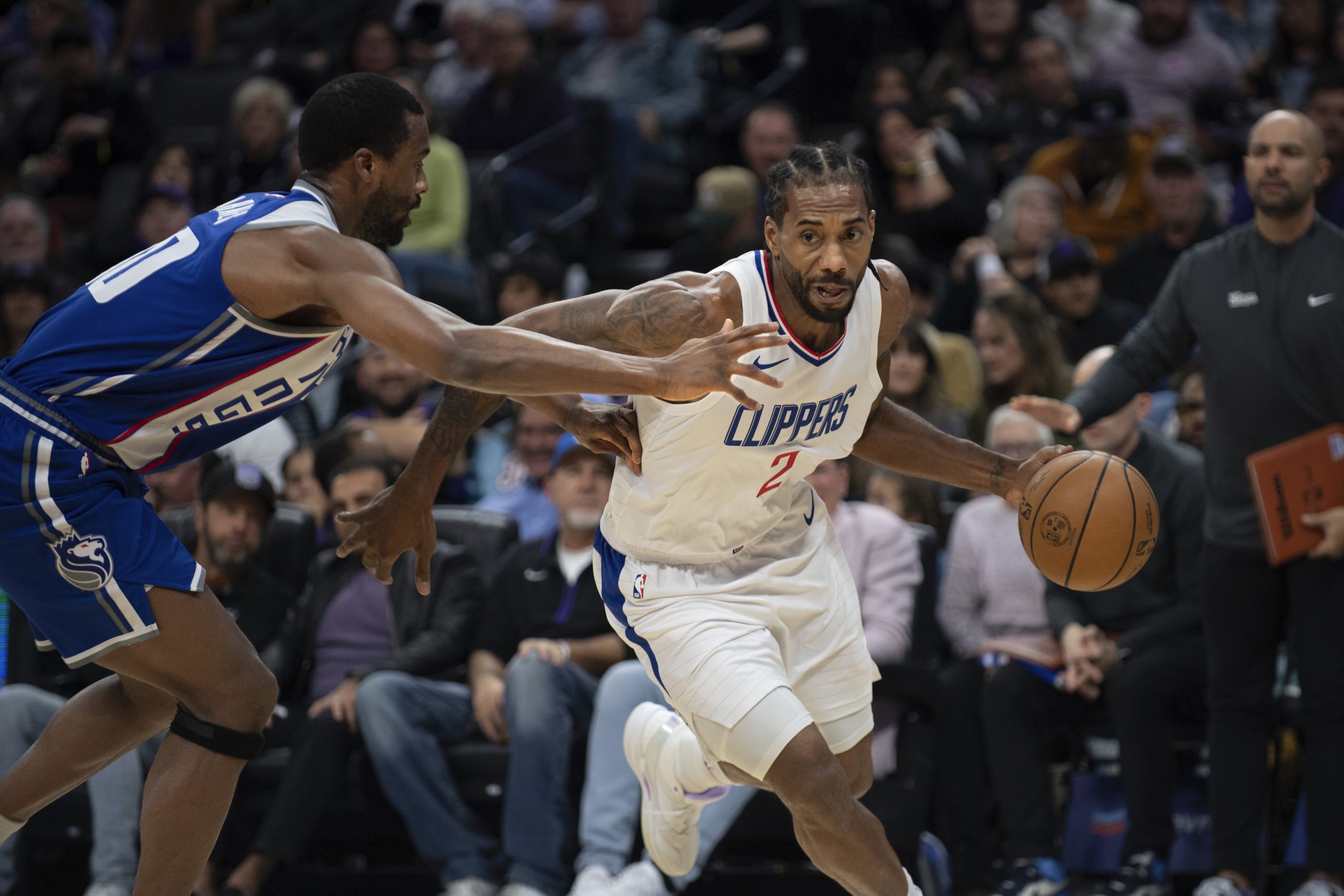 Clippers forward Kawhi Leonard gets past Sacramento Kings forward Harrison...