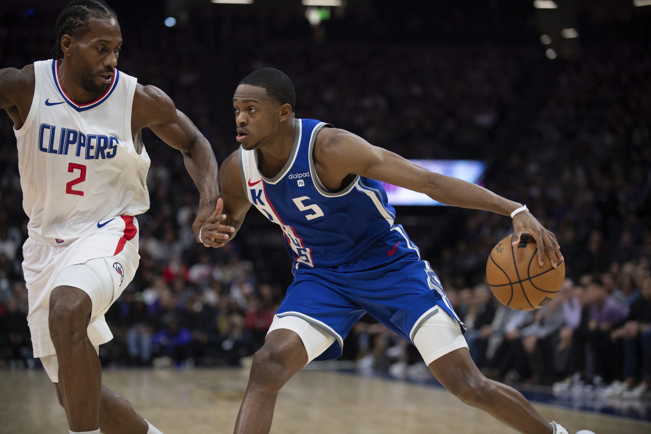 Sacramento Kings guard De’Aaron Fox drives as Clippers forward Kawhi...