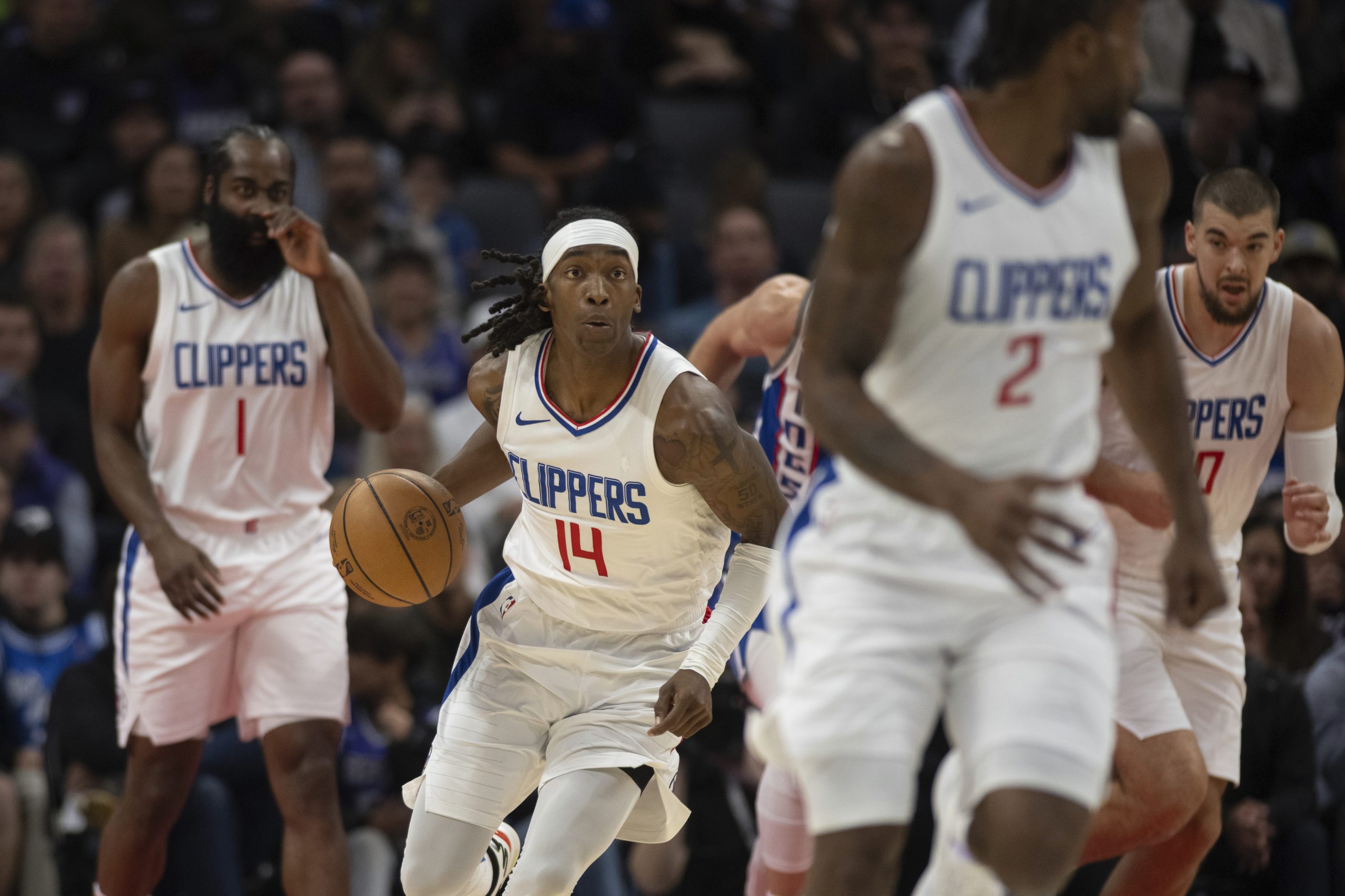 Clippers guard Terance Mann starts a fast break during the...