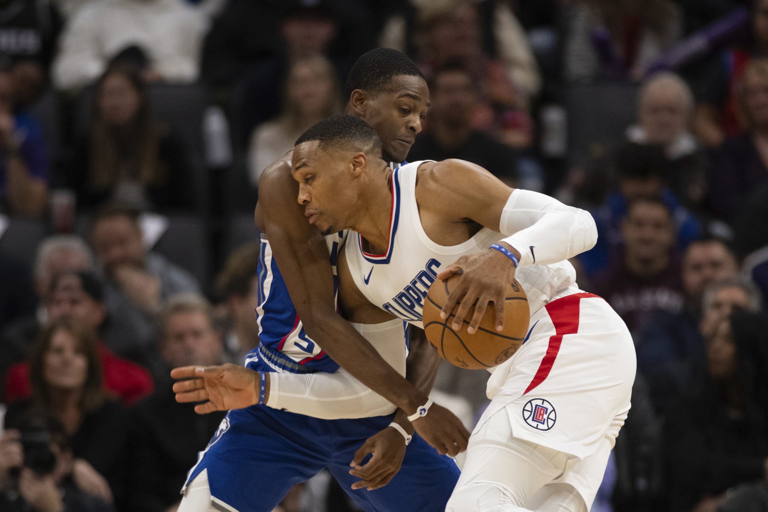 Clippers guard Russell Westbrook handles the ball as Sacramento Kings...