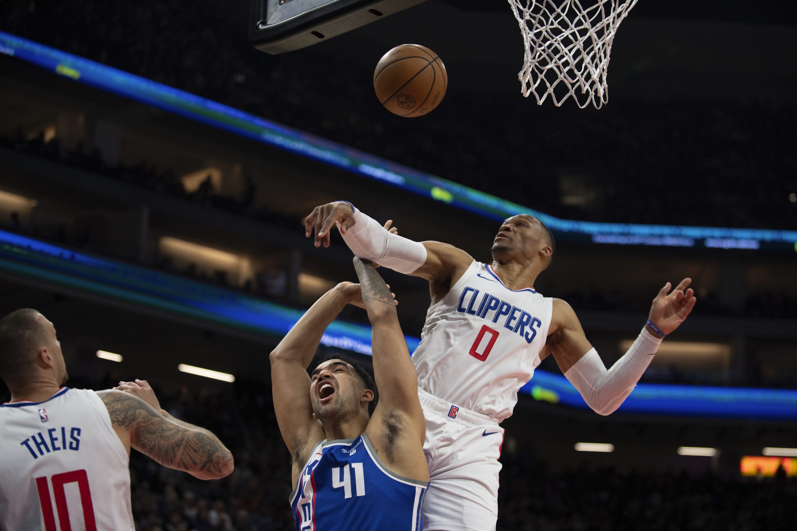 Sacramento Kings forward Trey Lyles, left, is fouled by Clippers...