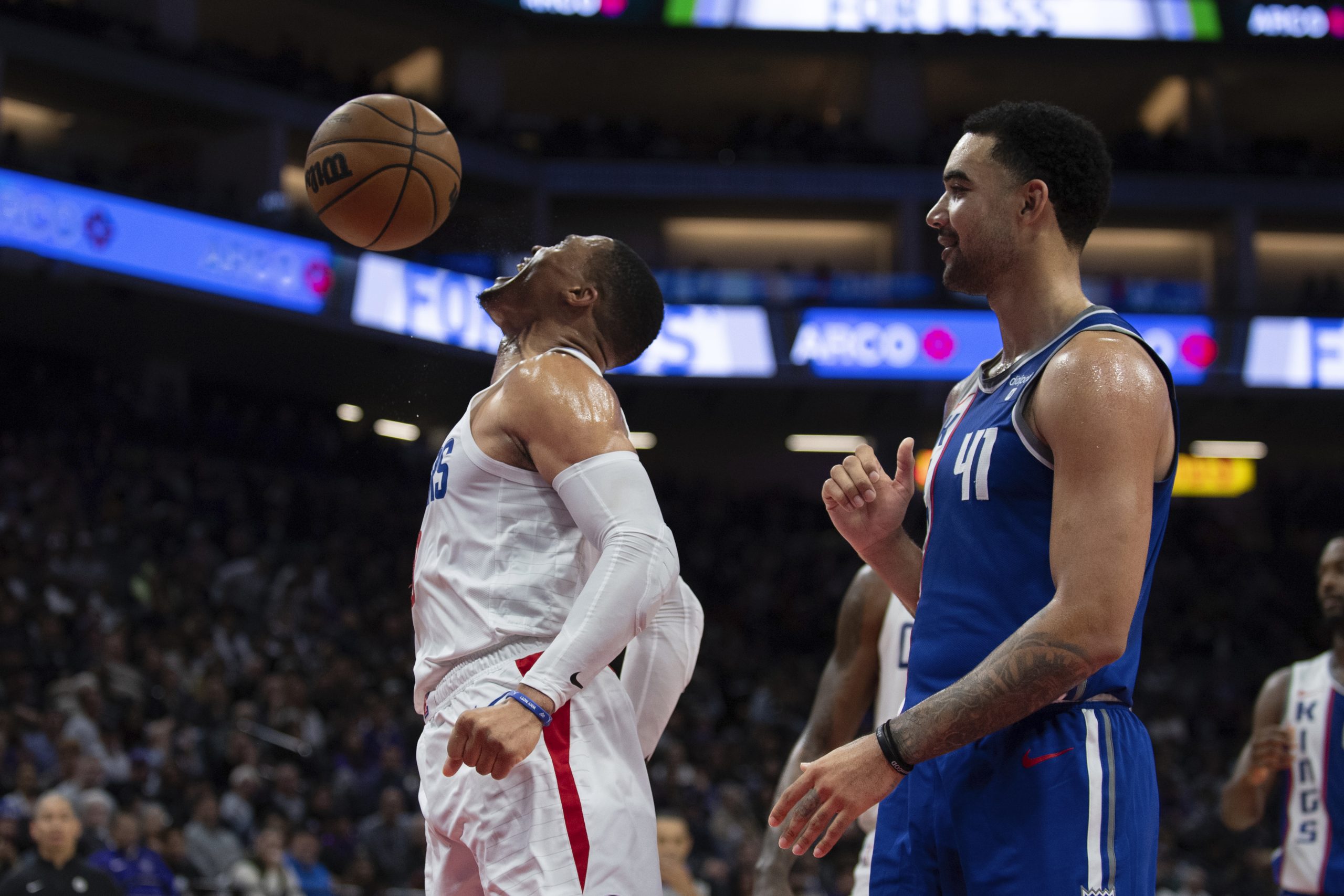 Clippers guard Russell Westbrook, left, lets out a yell and...