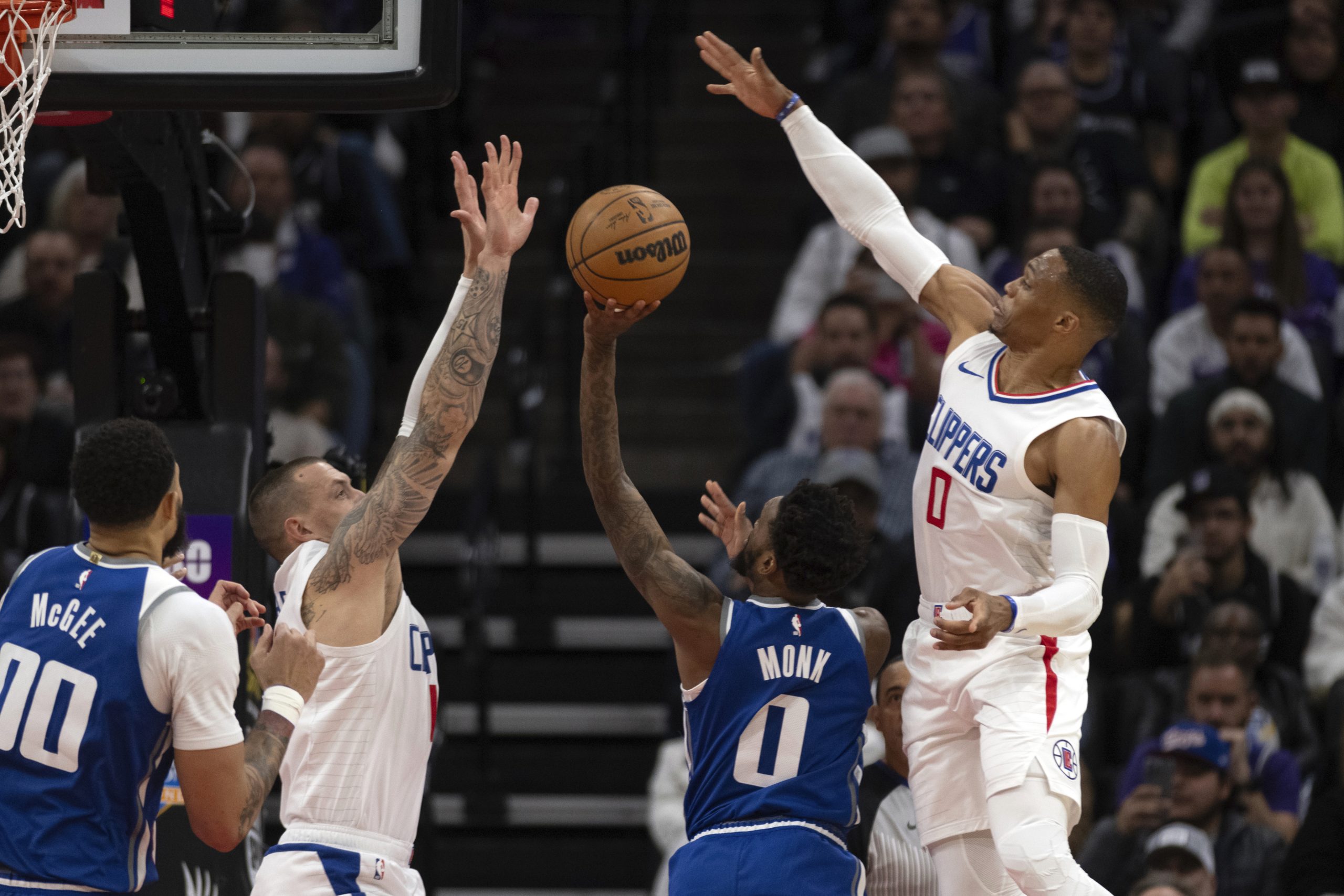 Clippers center Daniel Theis, second from left, and guard Russell...