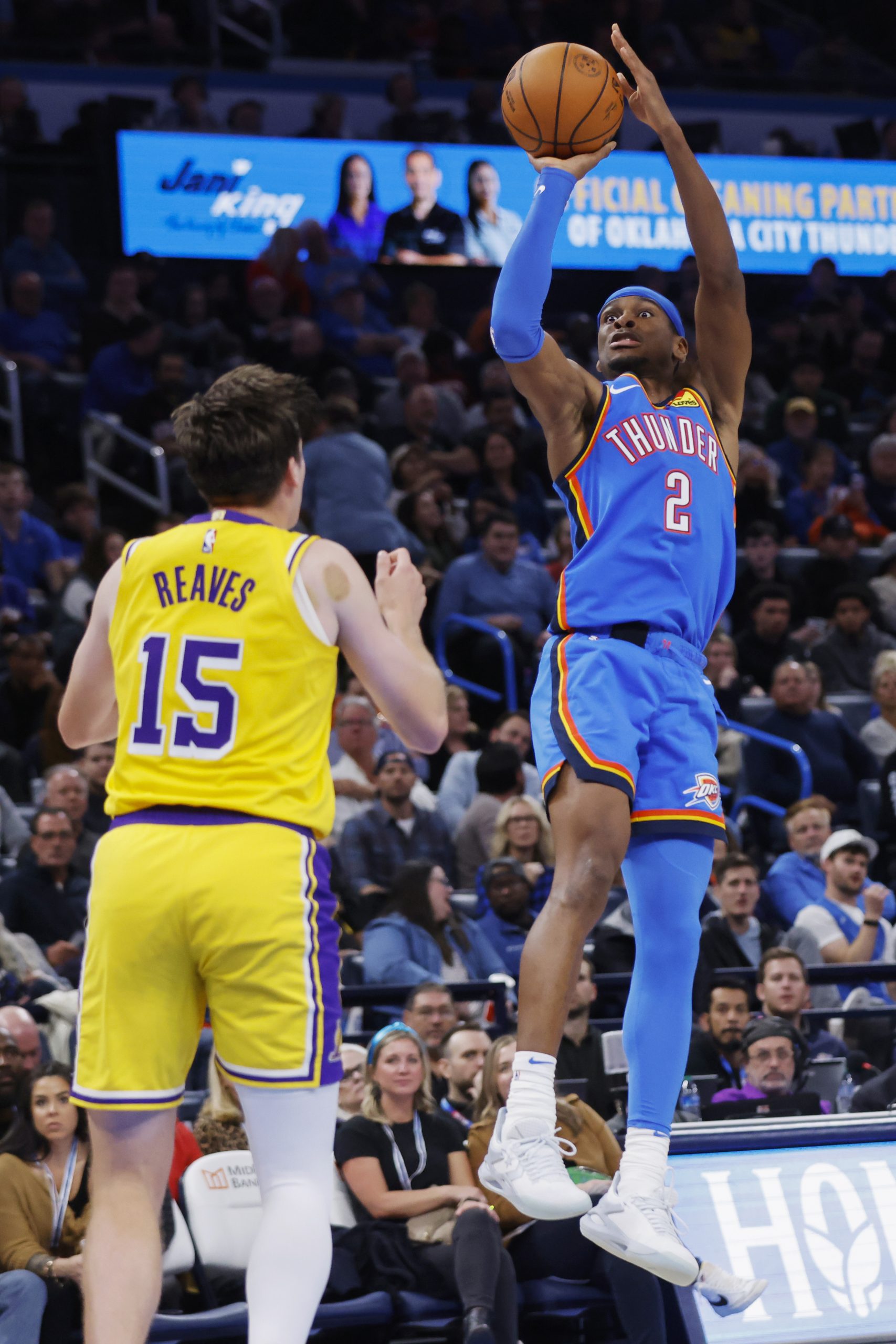 Oklahoma City Thunder guard Shai Gilgeous-Alexander shoots over Lakers guard...