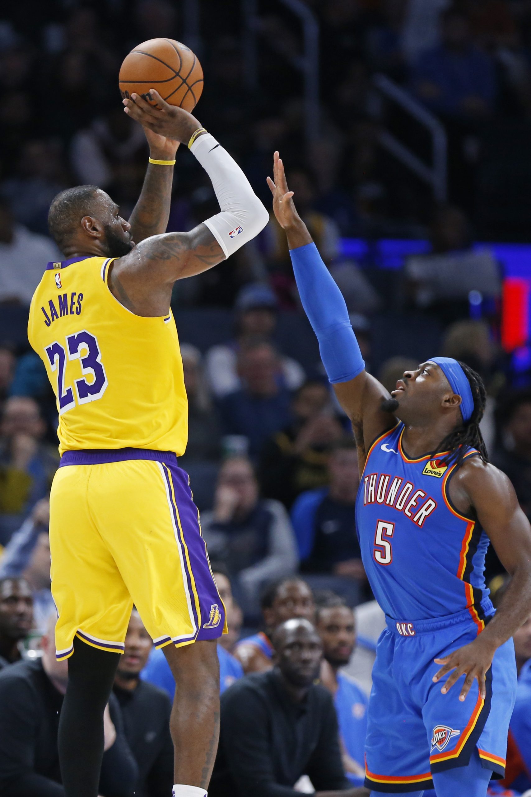 Lakers forward LeBron James shoots over Oklahoma City Thunder guard...
