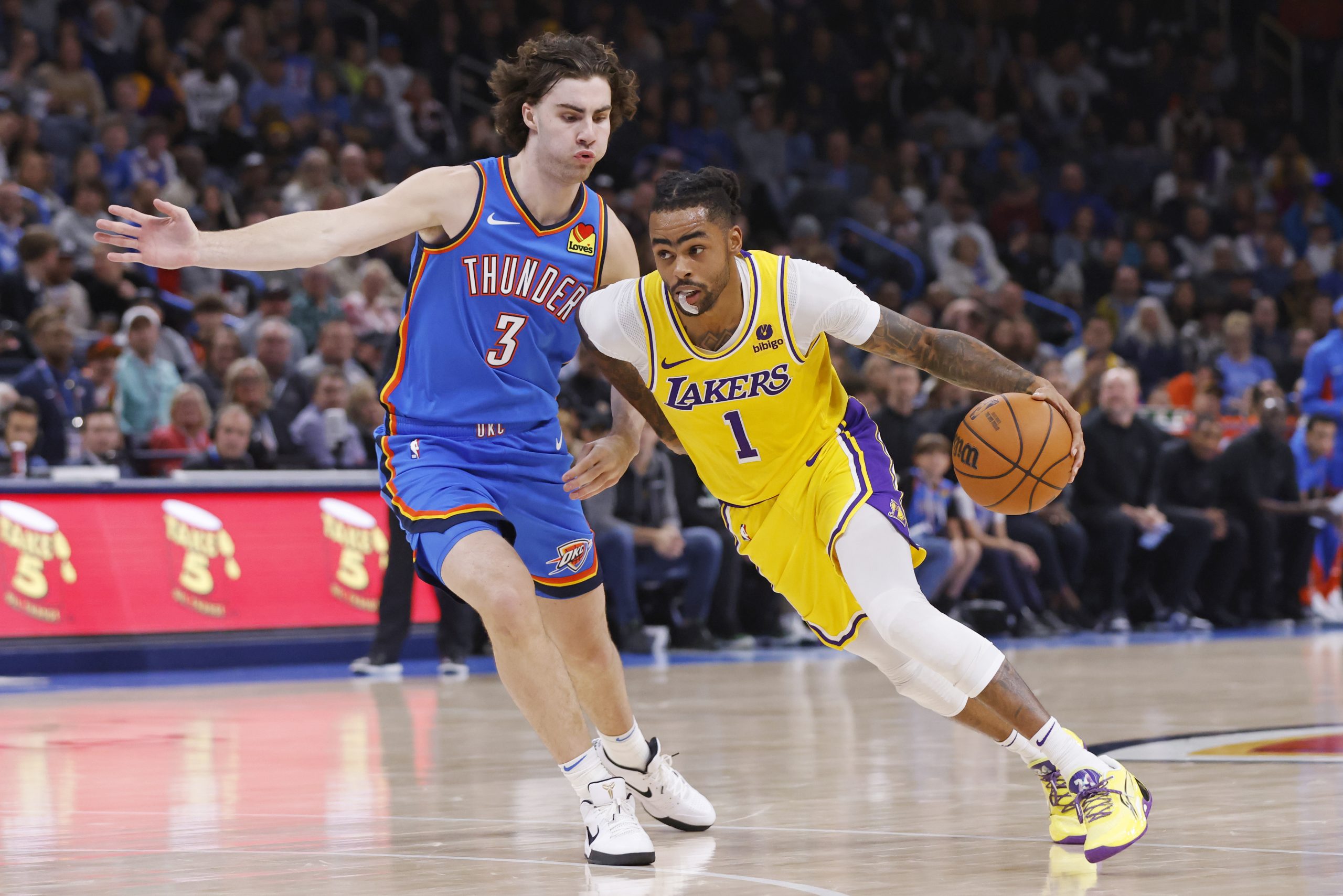 Lakers guard D’Angelo Russell drives against Oklahoma City Thunder guard...