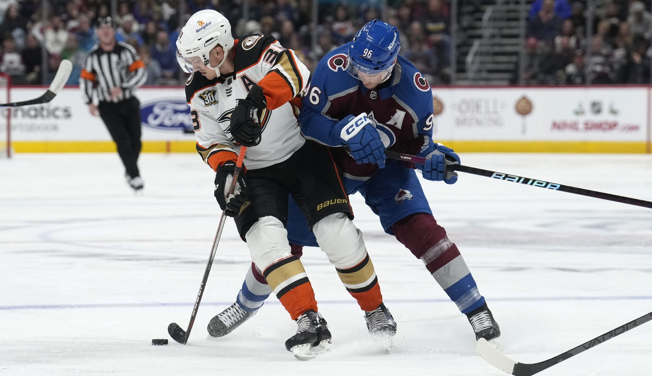 Ducks right wing Jakob Silfverberg, left, struggles to control the...