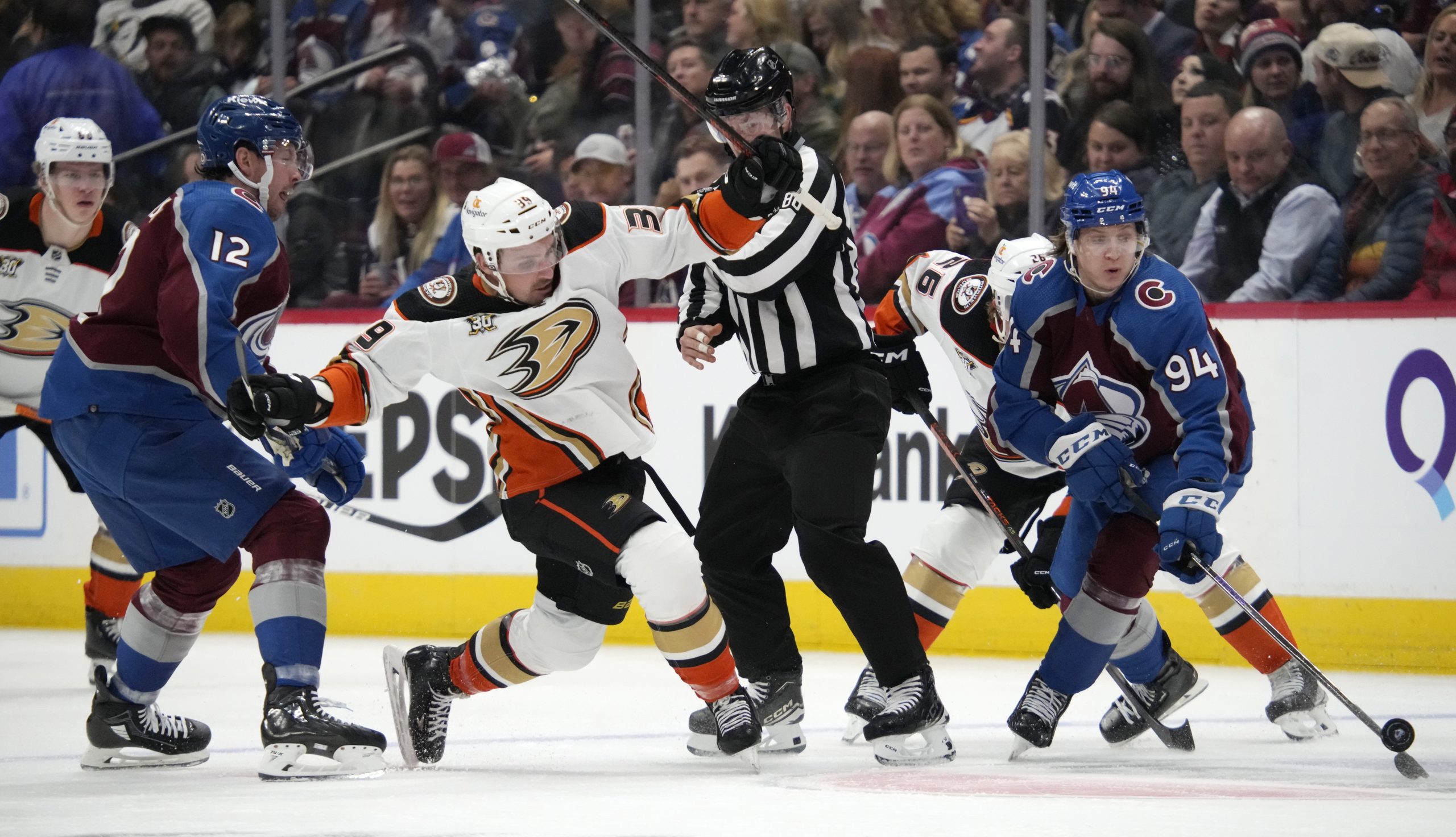 Colorado Avalanche center Joel Kiviranta, right, collects the puck as...