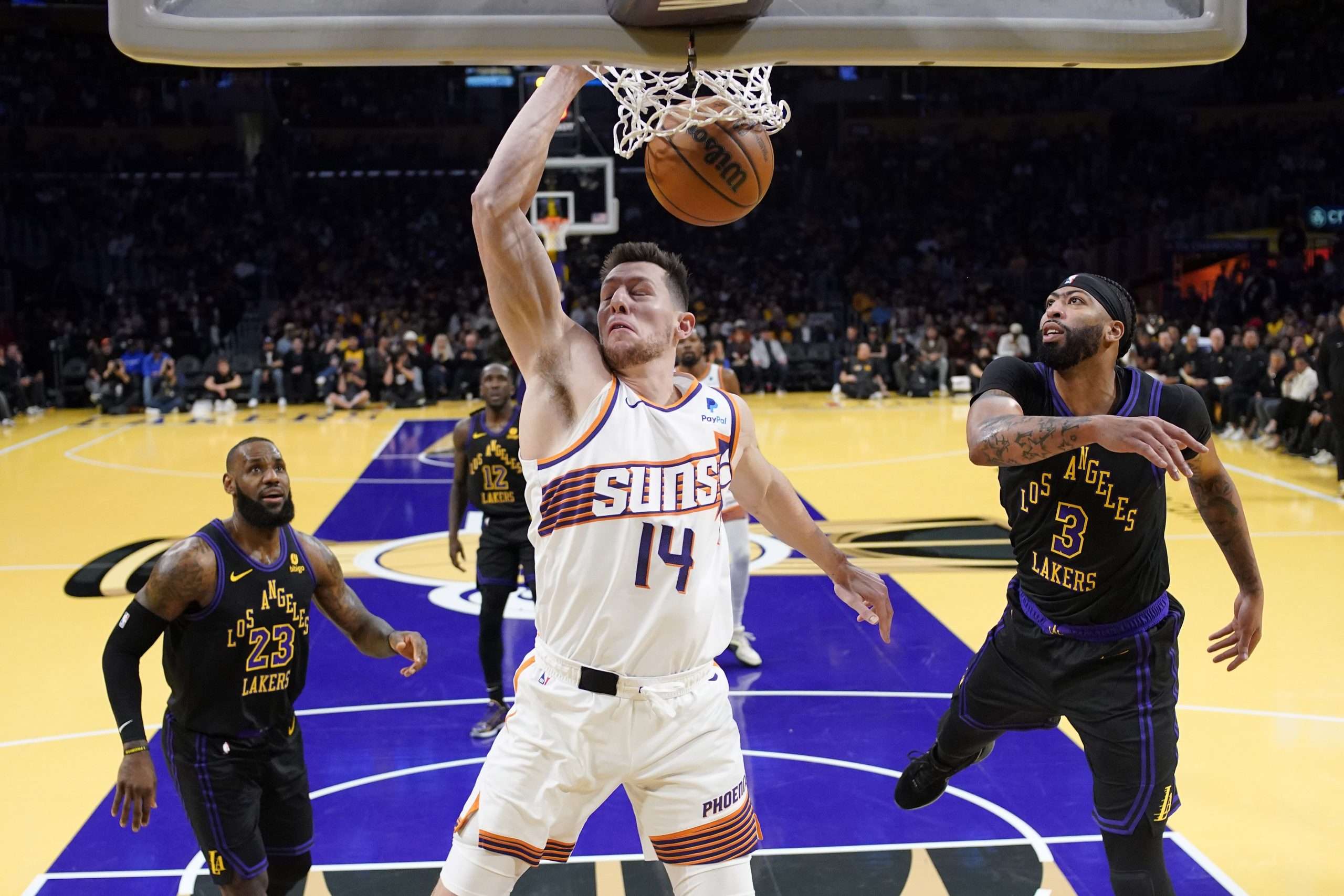 Phoenix Suns forward Drew Eubanks dunks as Lakers forward LeBron...