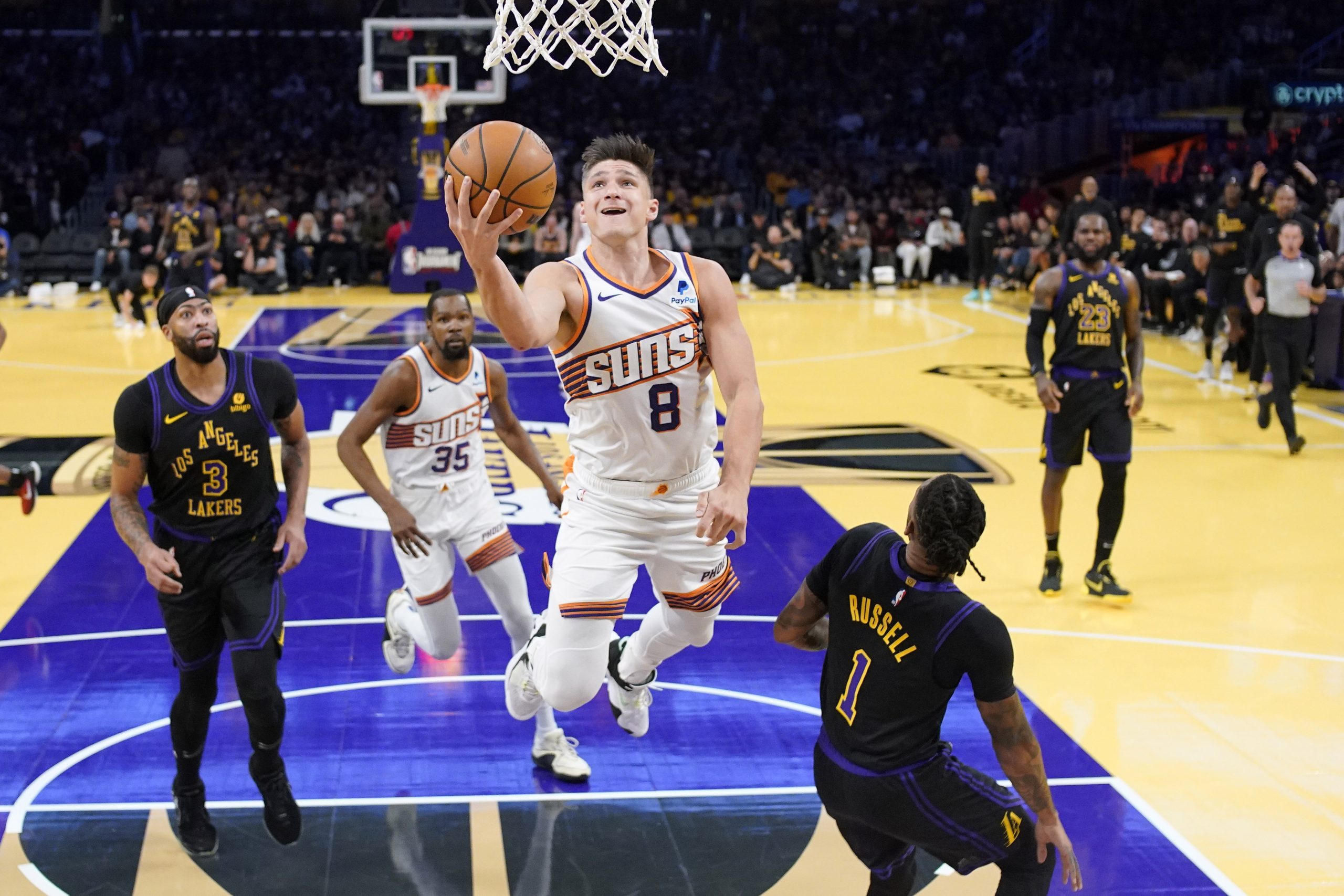 Phoenix Suns guard Grayson Allen shoots as Lakers forward Anthony...