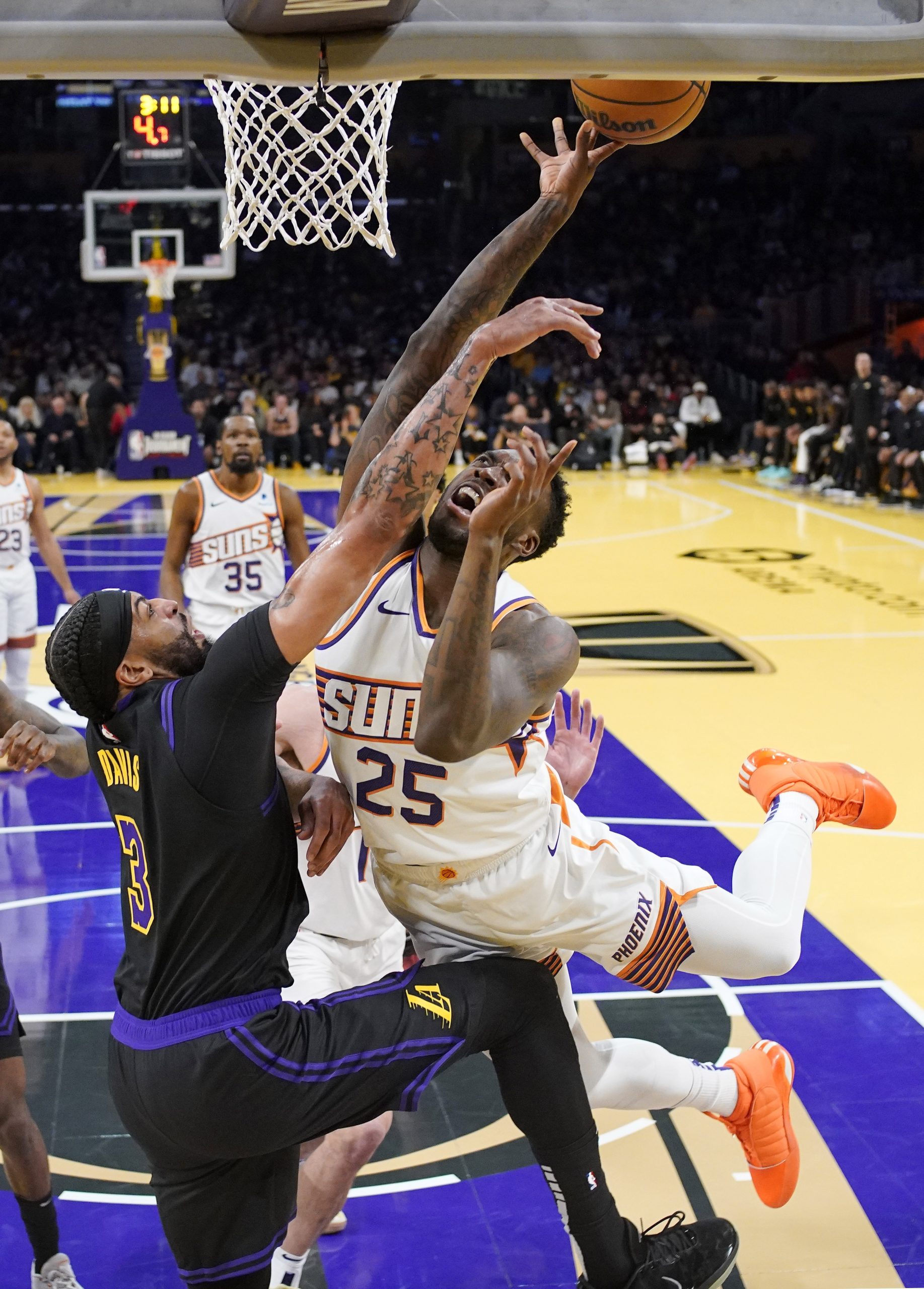 Phoenix Suns forward Nassir Little (25) shoots as Lakers forward...