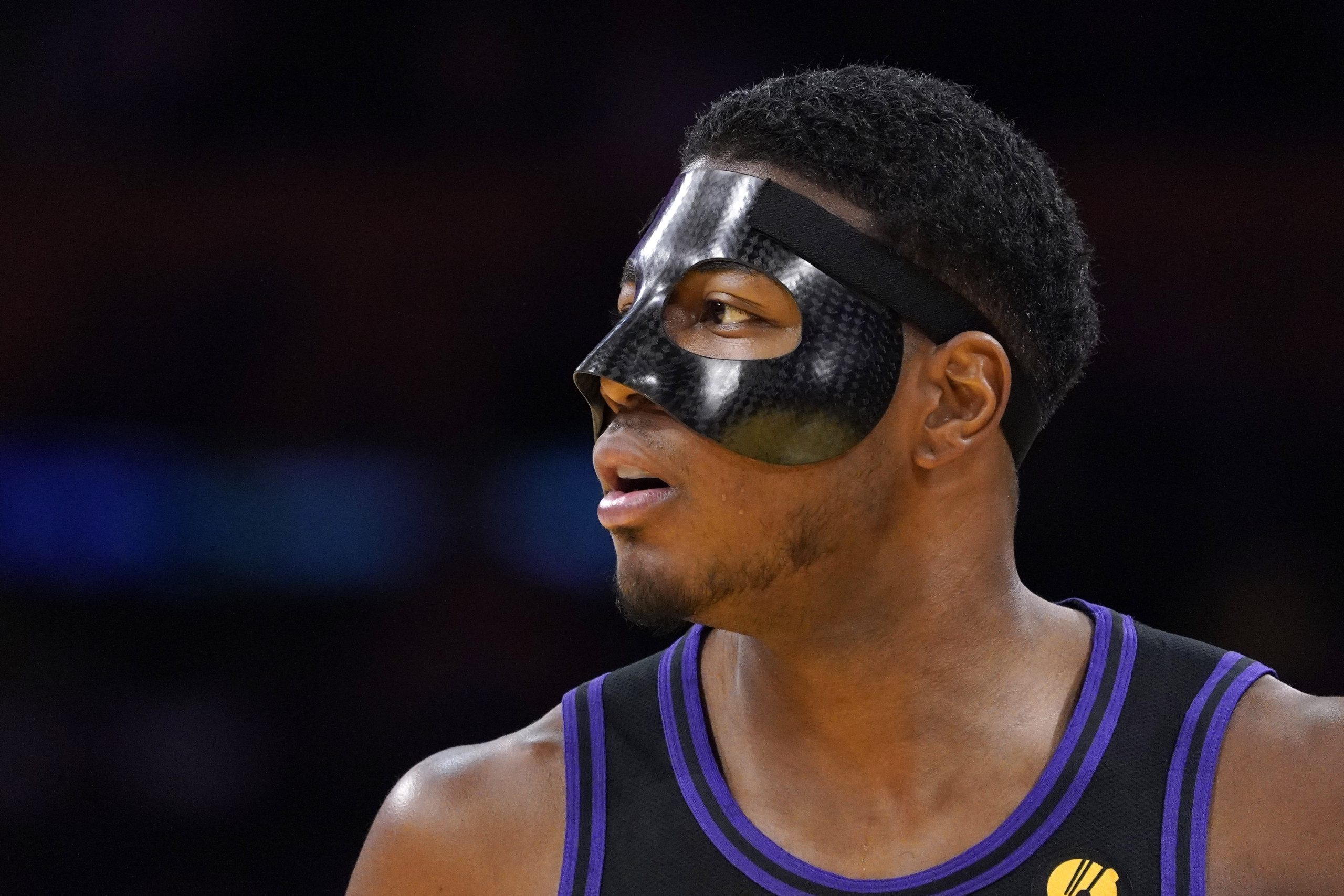 Lakers forward Rui Hachimura stands on the court while wearing...
