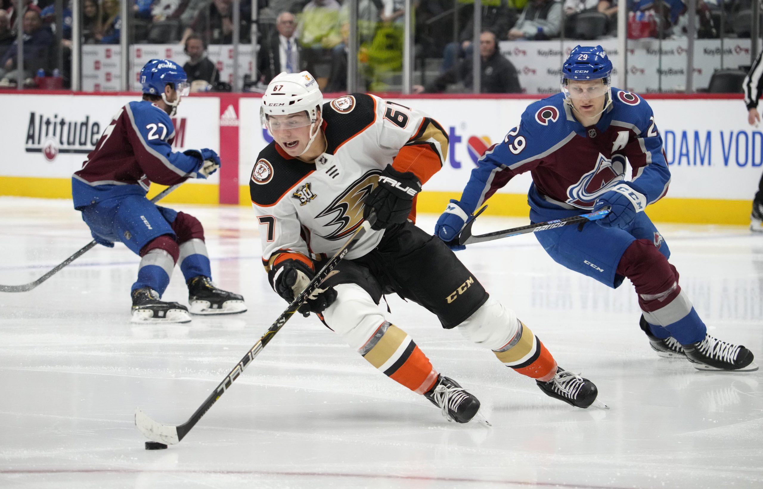 Ducks defenseman Tristan Luneau, front, collects the puck as Colorado...