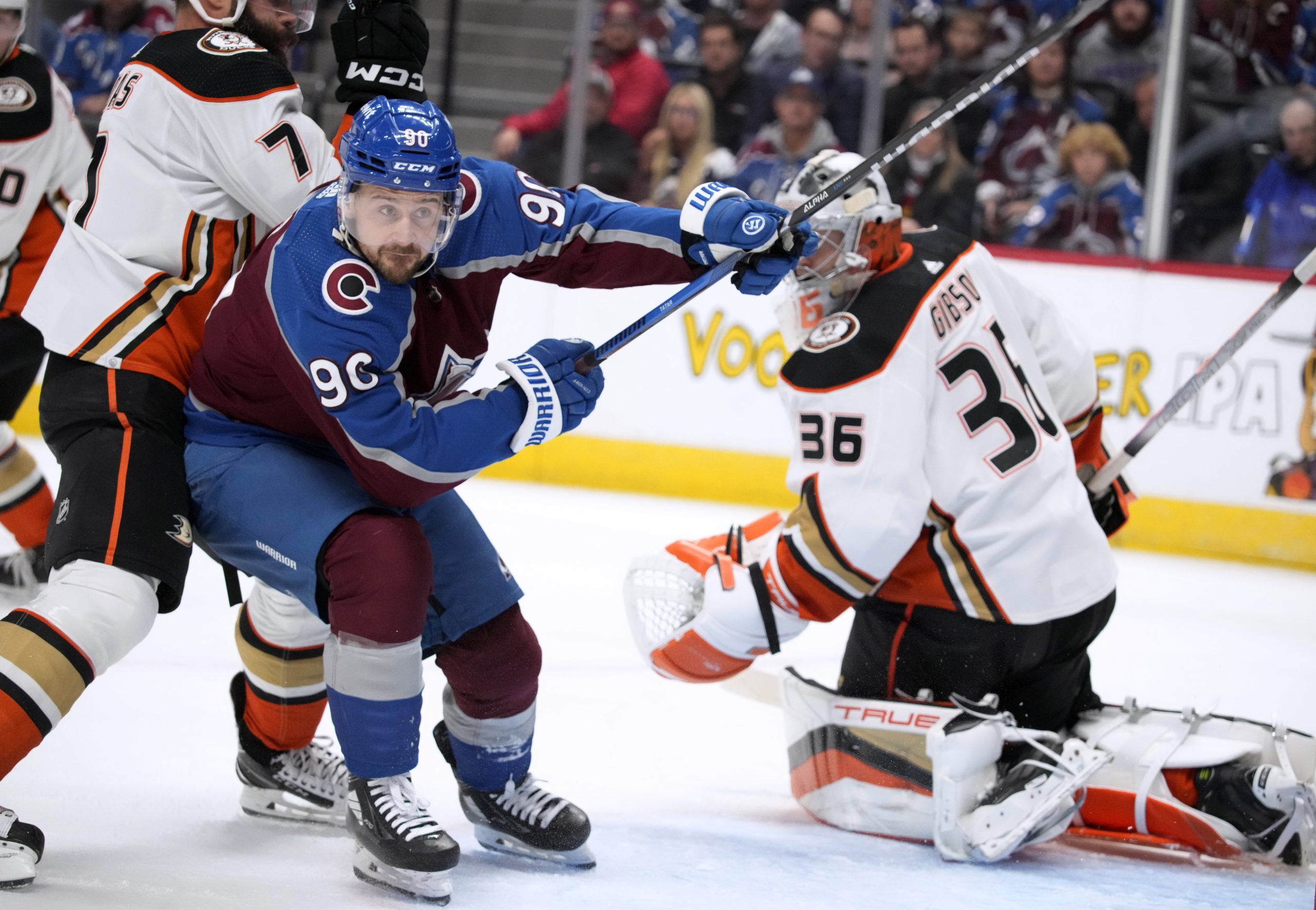 Colorado Avalanche left wing Tomas Tatar, center, is checked by...