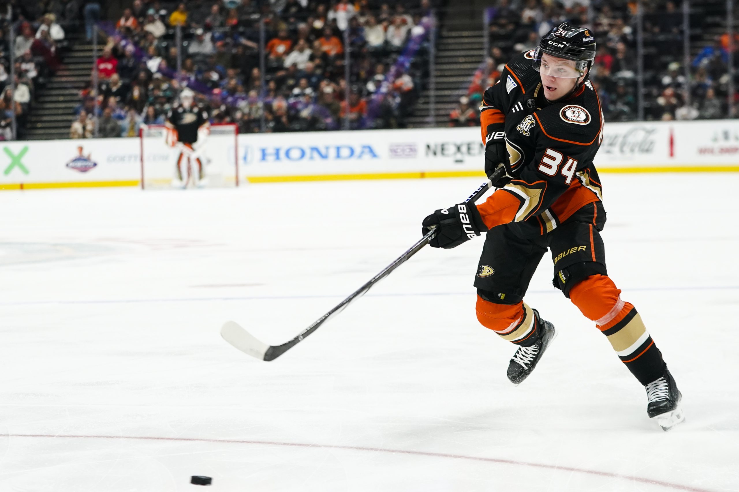 Anaheim Ducks defenseman Pavel Mintyukov shoots during the first period...