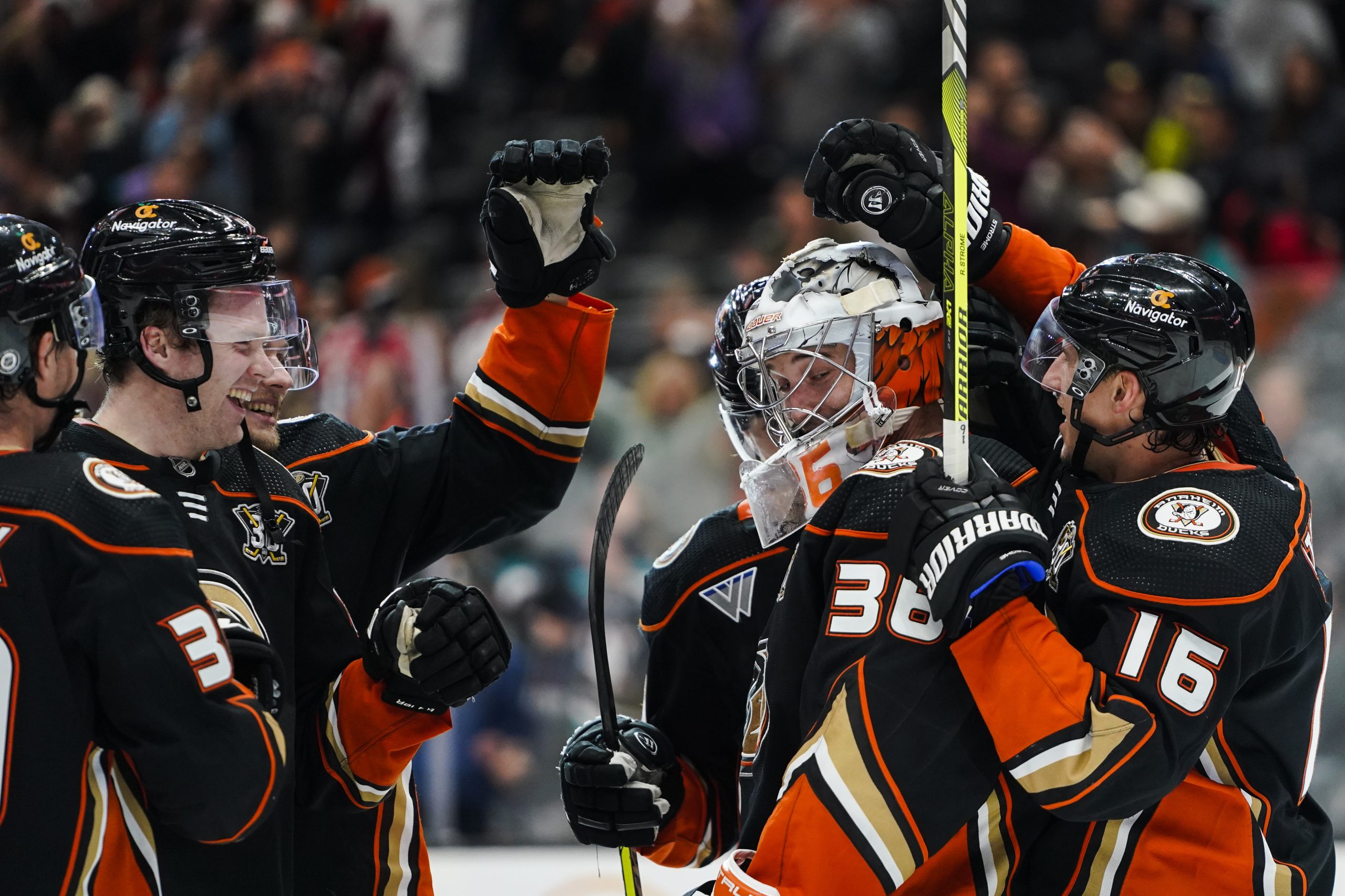 Anaheim Ducks goaltender John Gibson (36) is congratulated by teammates...