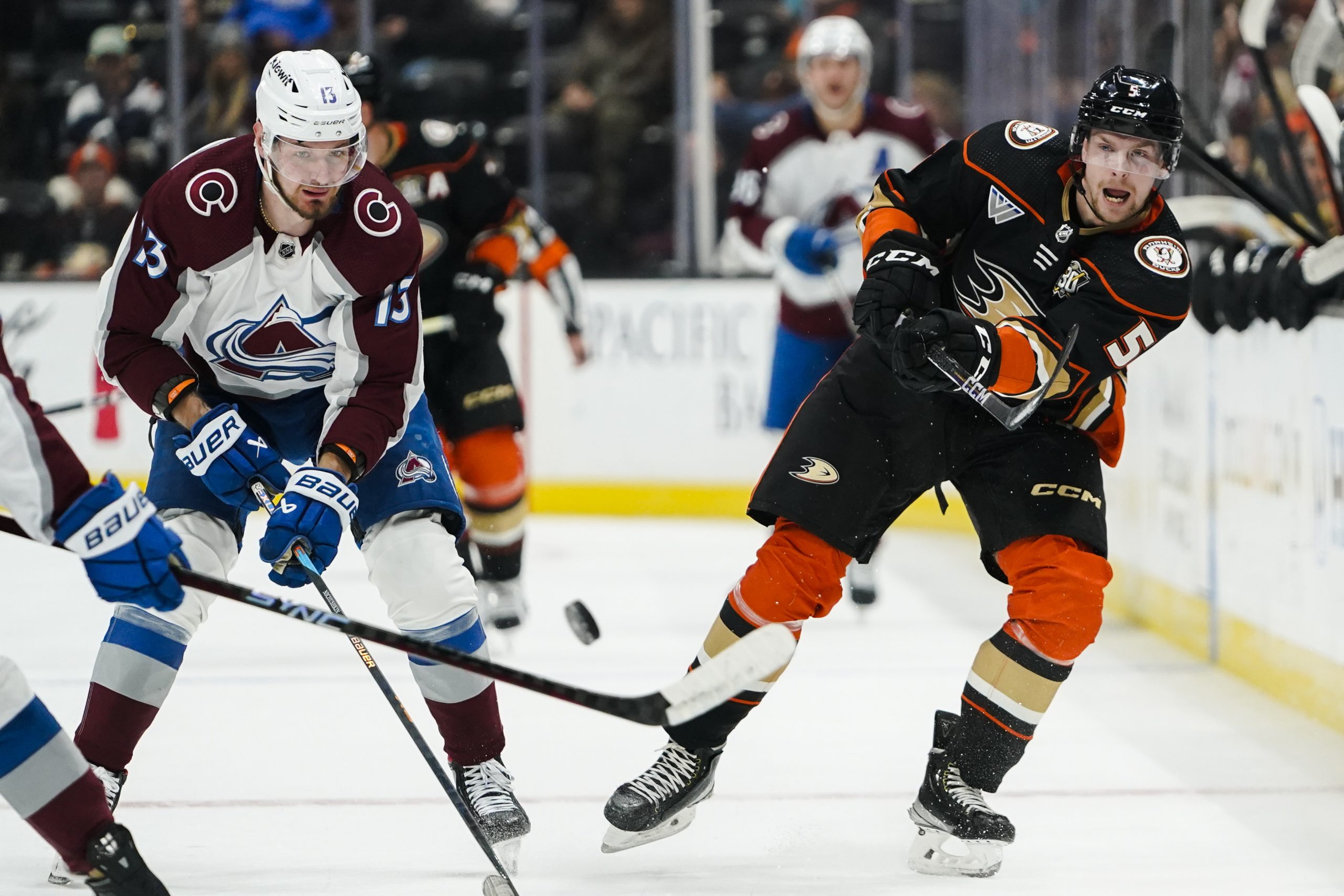 Anaheim Ducks defenseman Urho Vaakanainen (5) sends the puck ahead...