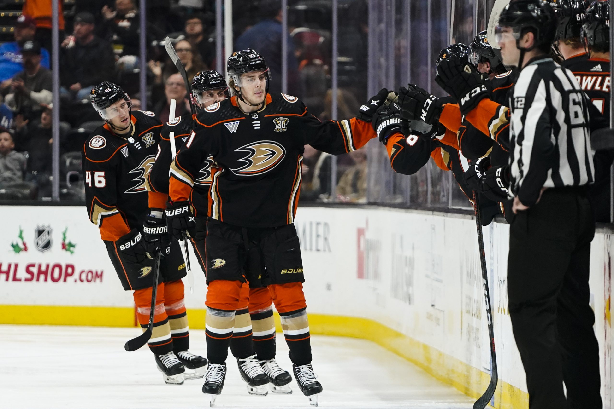 Anaheim Ducks center Leo Carlsson is congratulated for his goal...