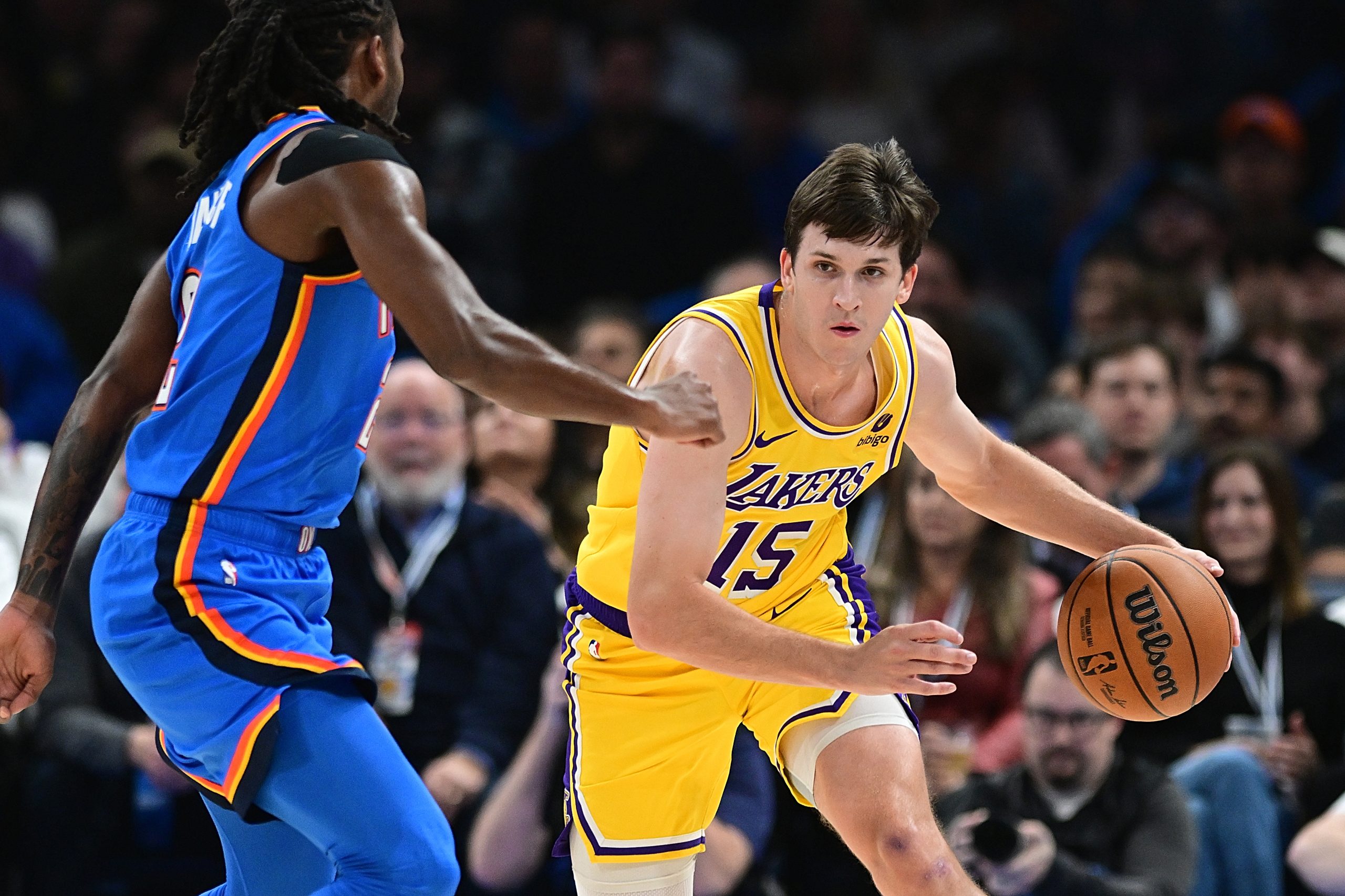 Lakers guard Austin Reaves handles the ball during the first...