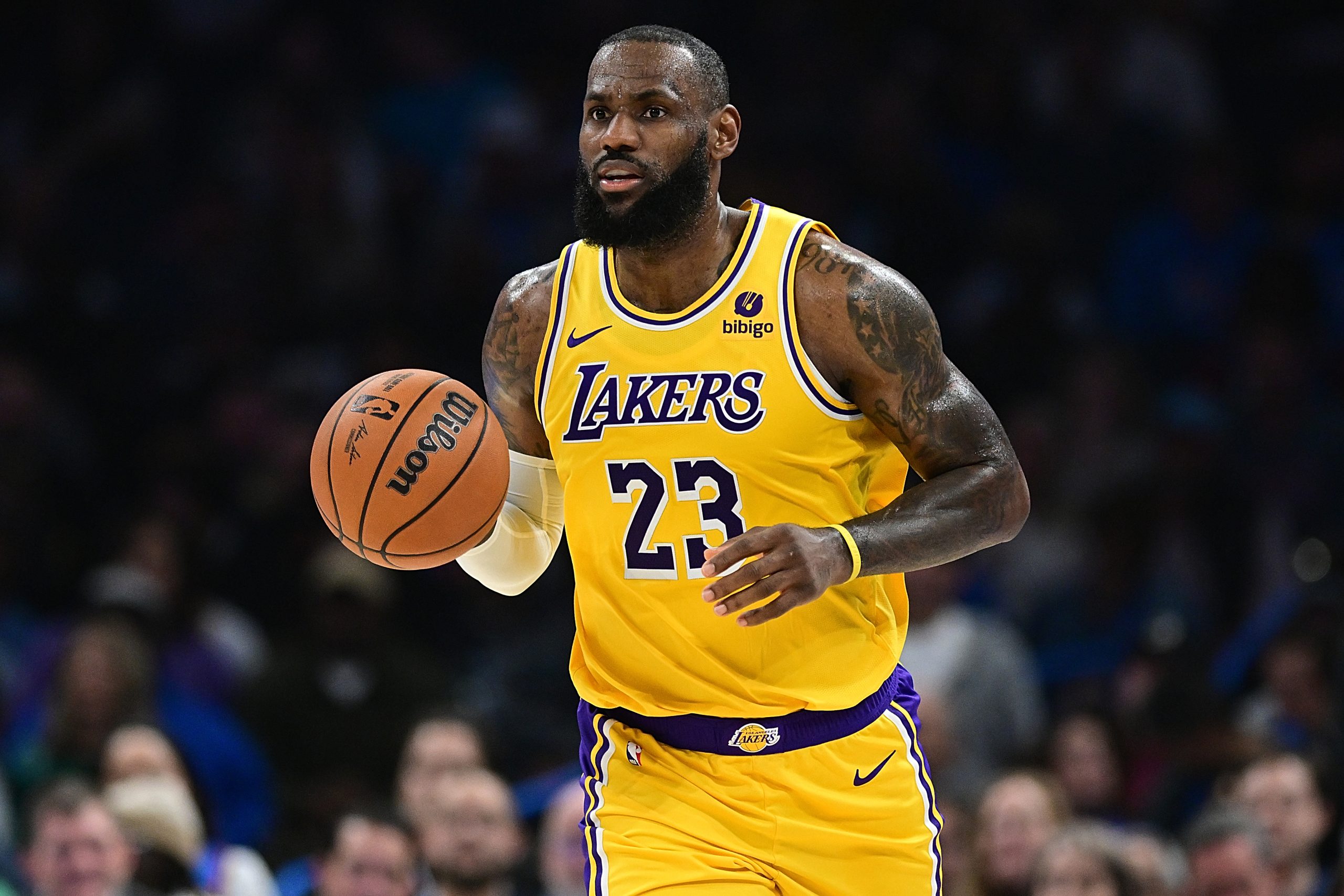 Lakers star Lebron James brings the ball up the court...