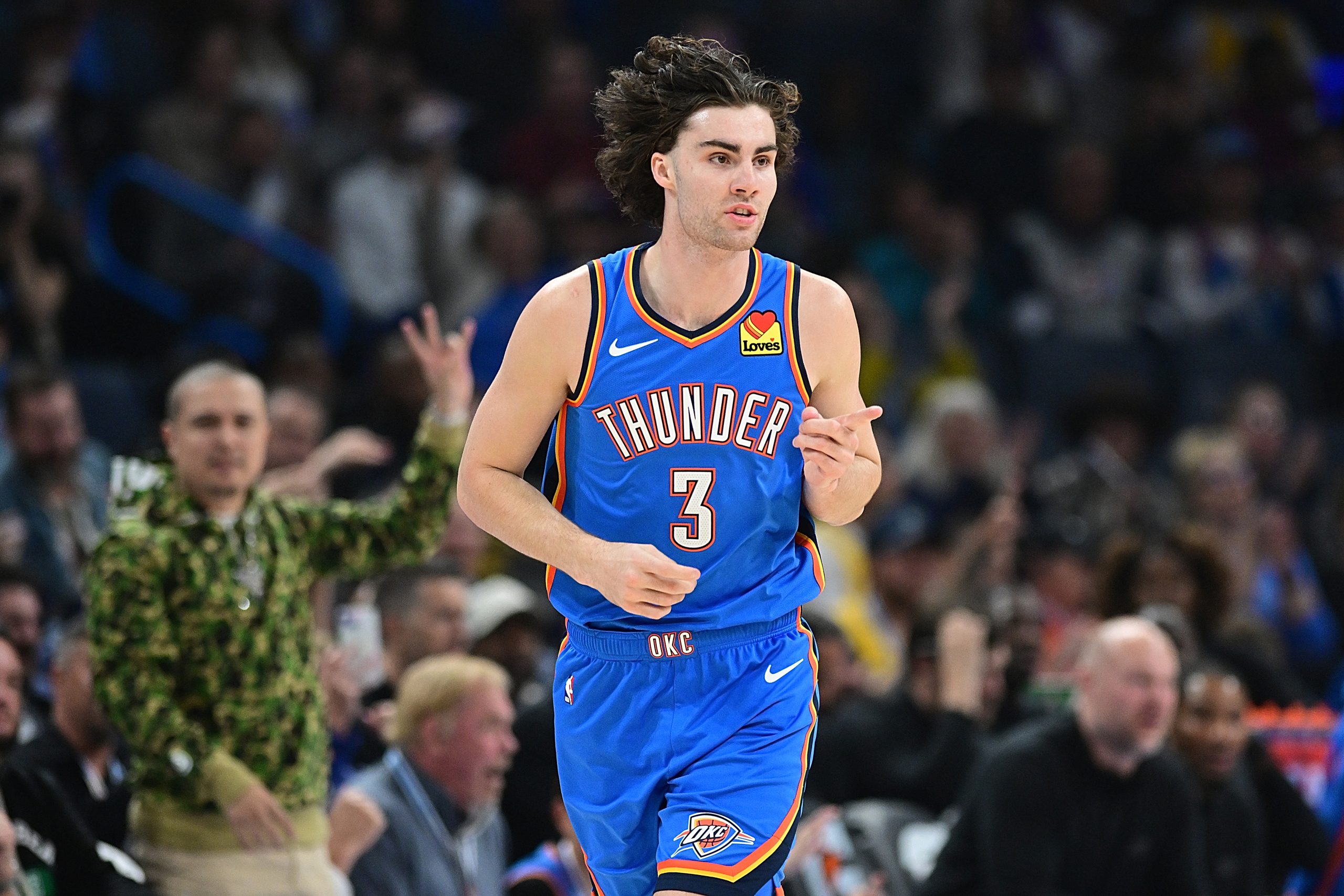 The Oklahoma City Thunder’s Josh Giddey gestures to a teammate...