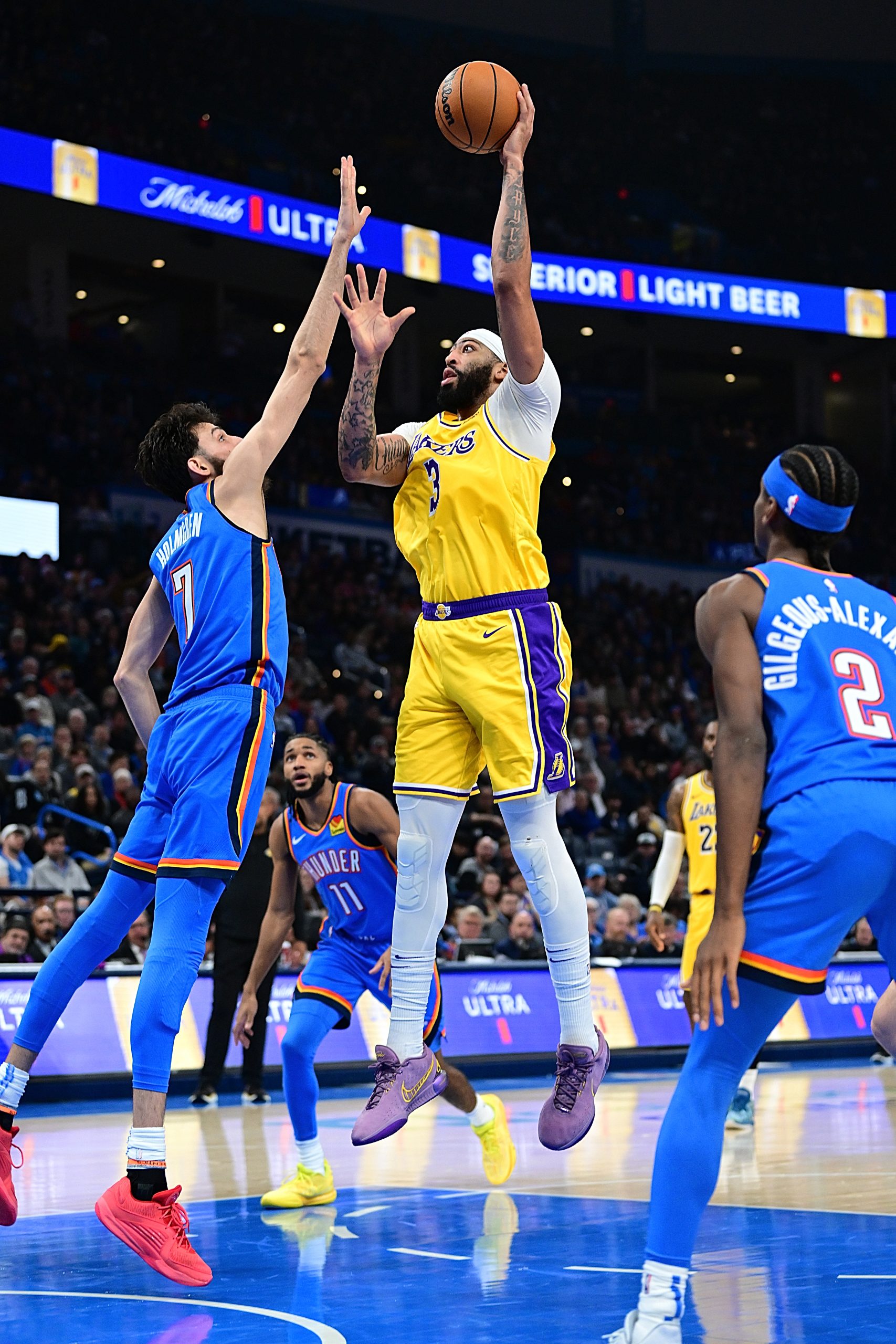 Lakers star Anthony Davis puts up a shot over the...