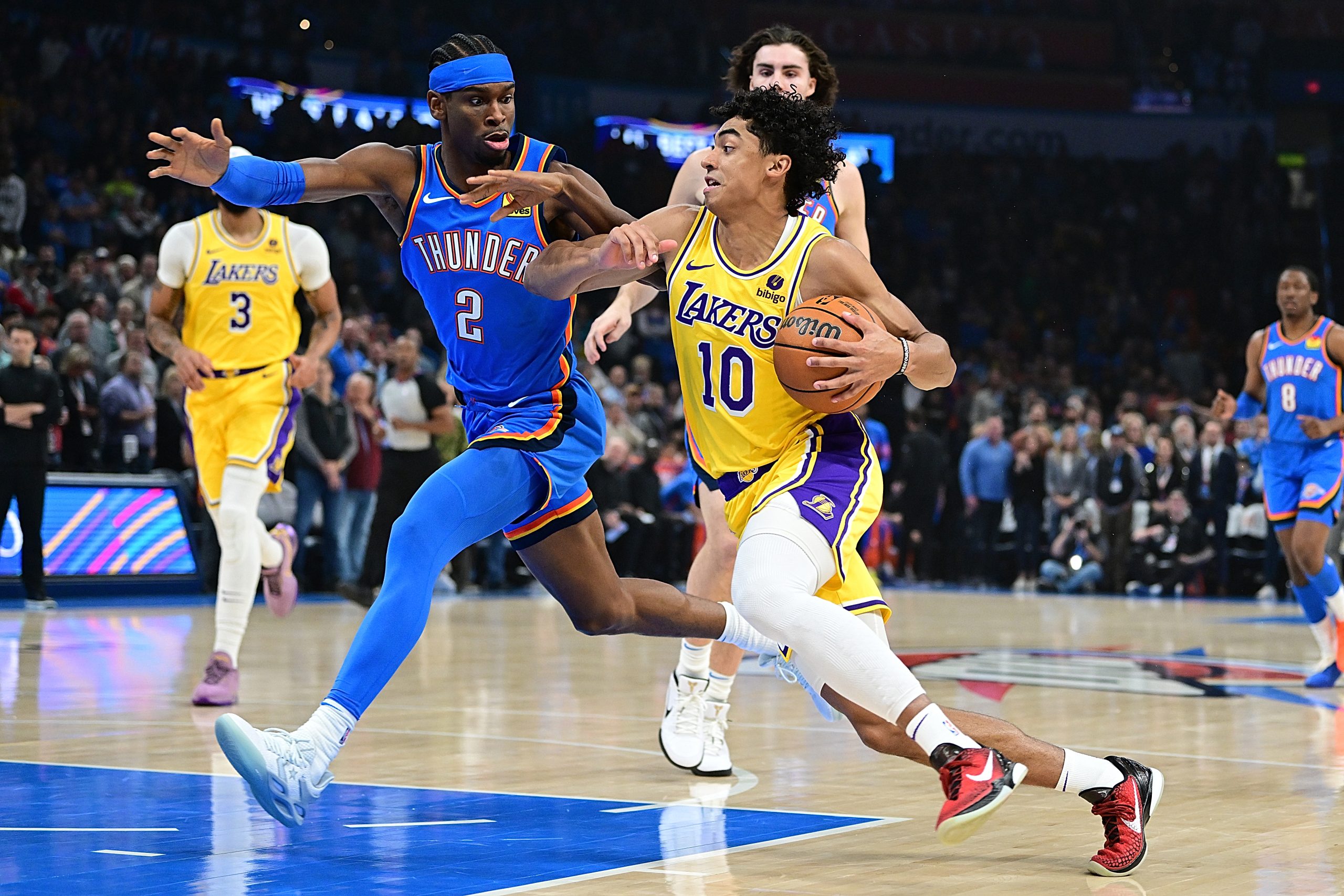 Lakers guard Max Christie attempts to go around the Oklahoma...