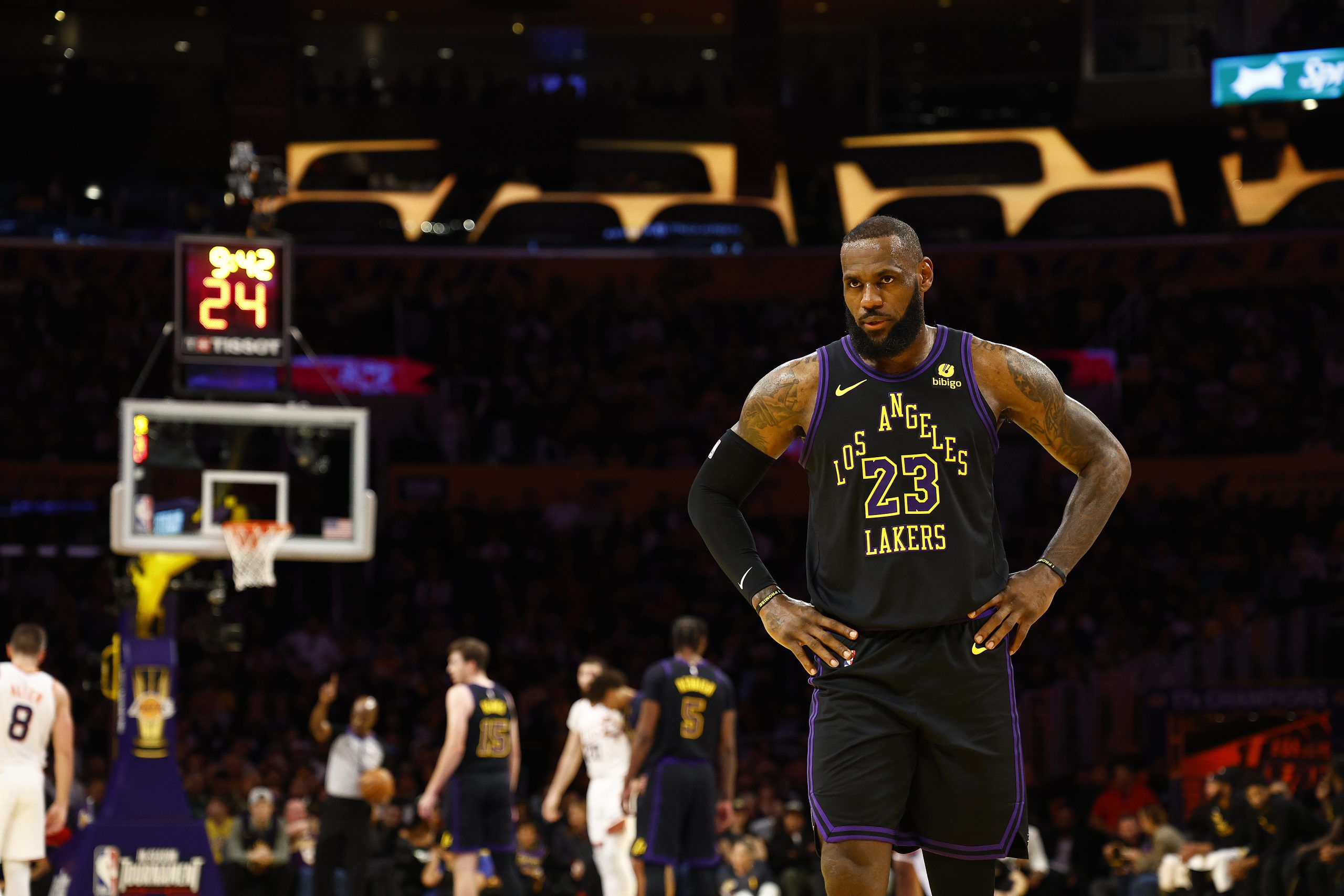 Lakers star LeBron James looks on during the first half...