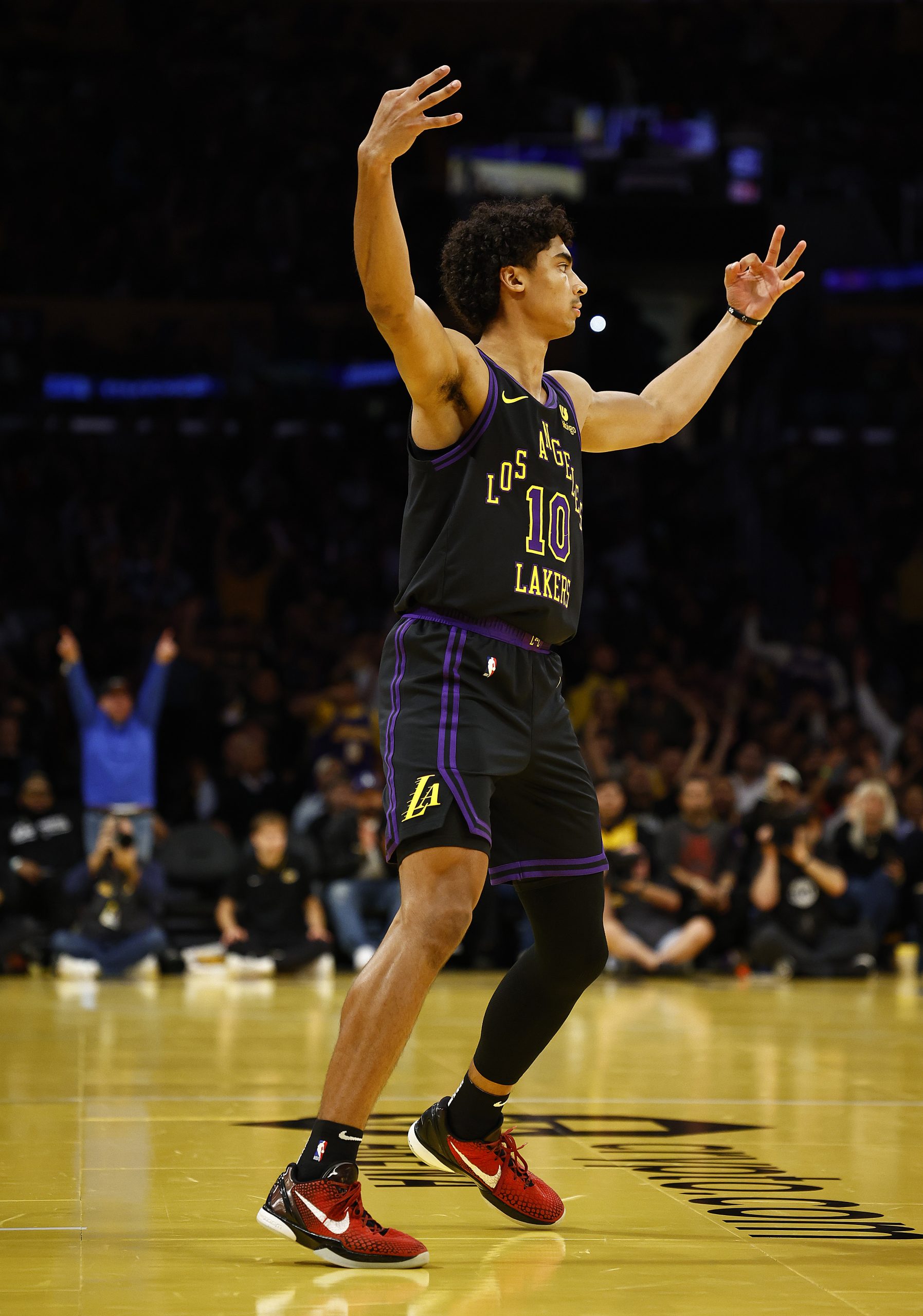 Lakers guard Max Christie celebrates after making a 3-point shot...