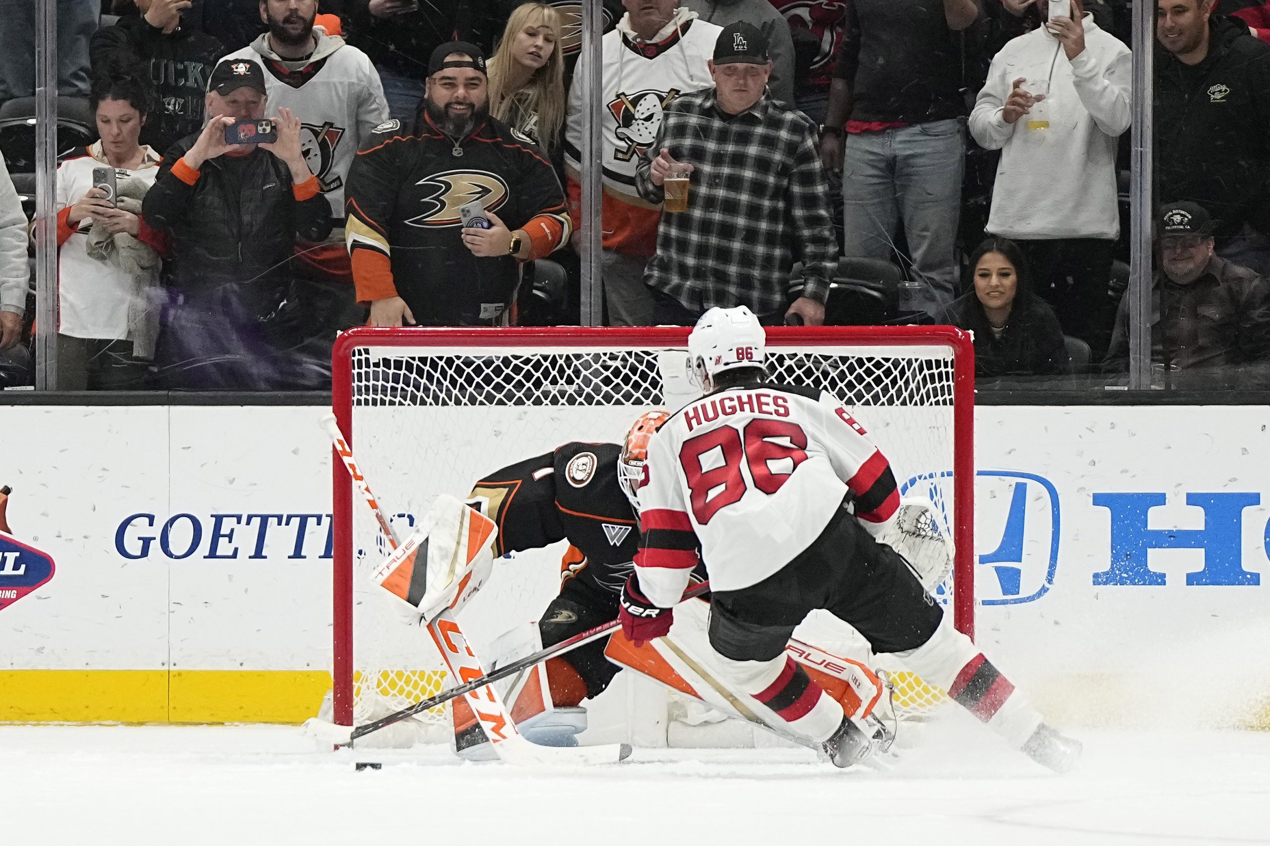 Ducks goaltender Lukas Dostal, left, stops a penalty shot by...