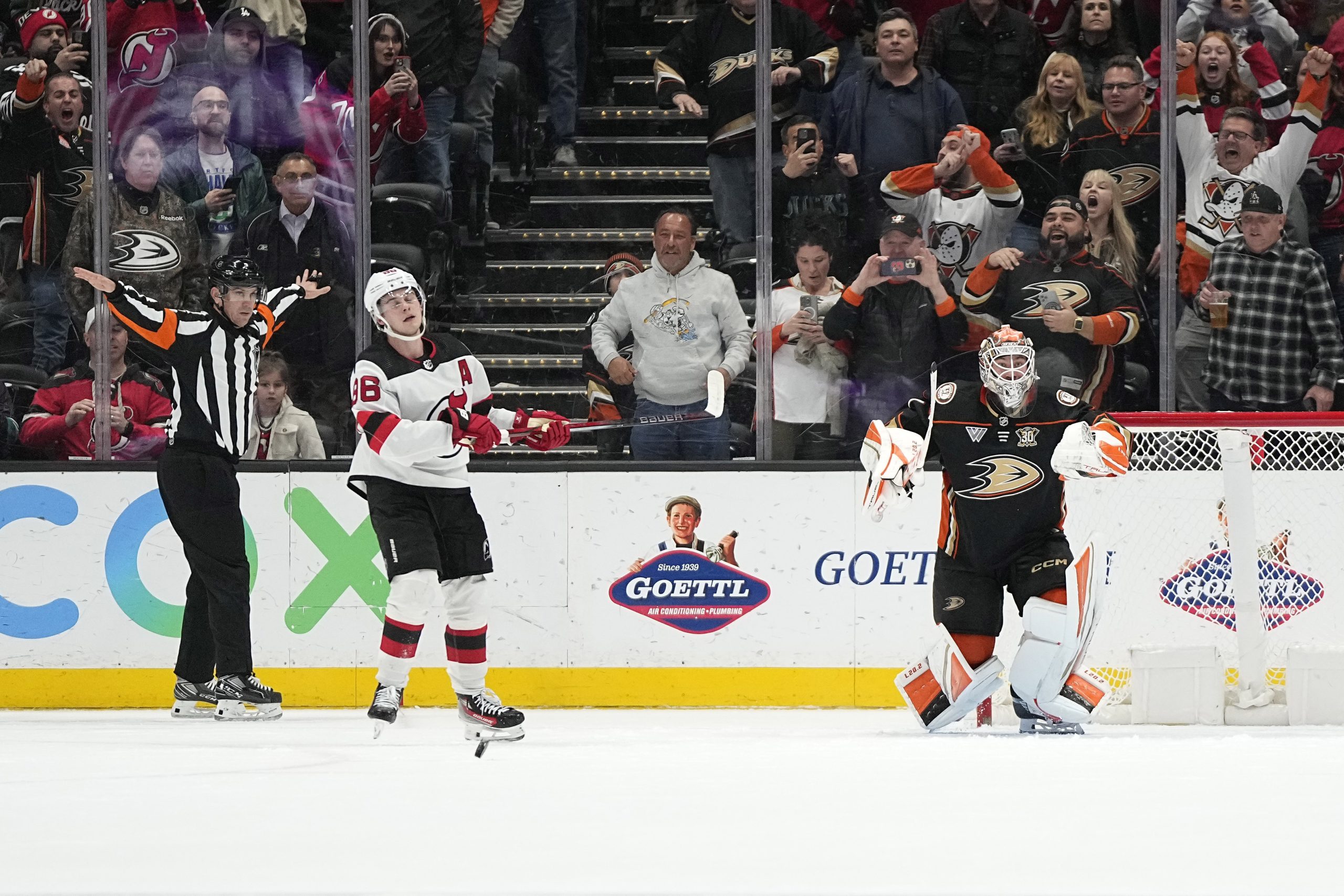 Ducks goaltender Lukas Dostal, right, celebrates after stopping a penalty...